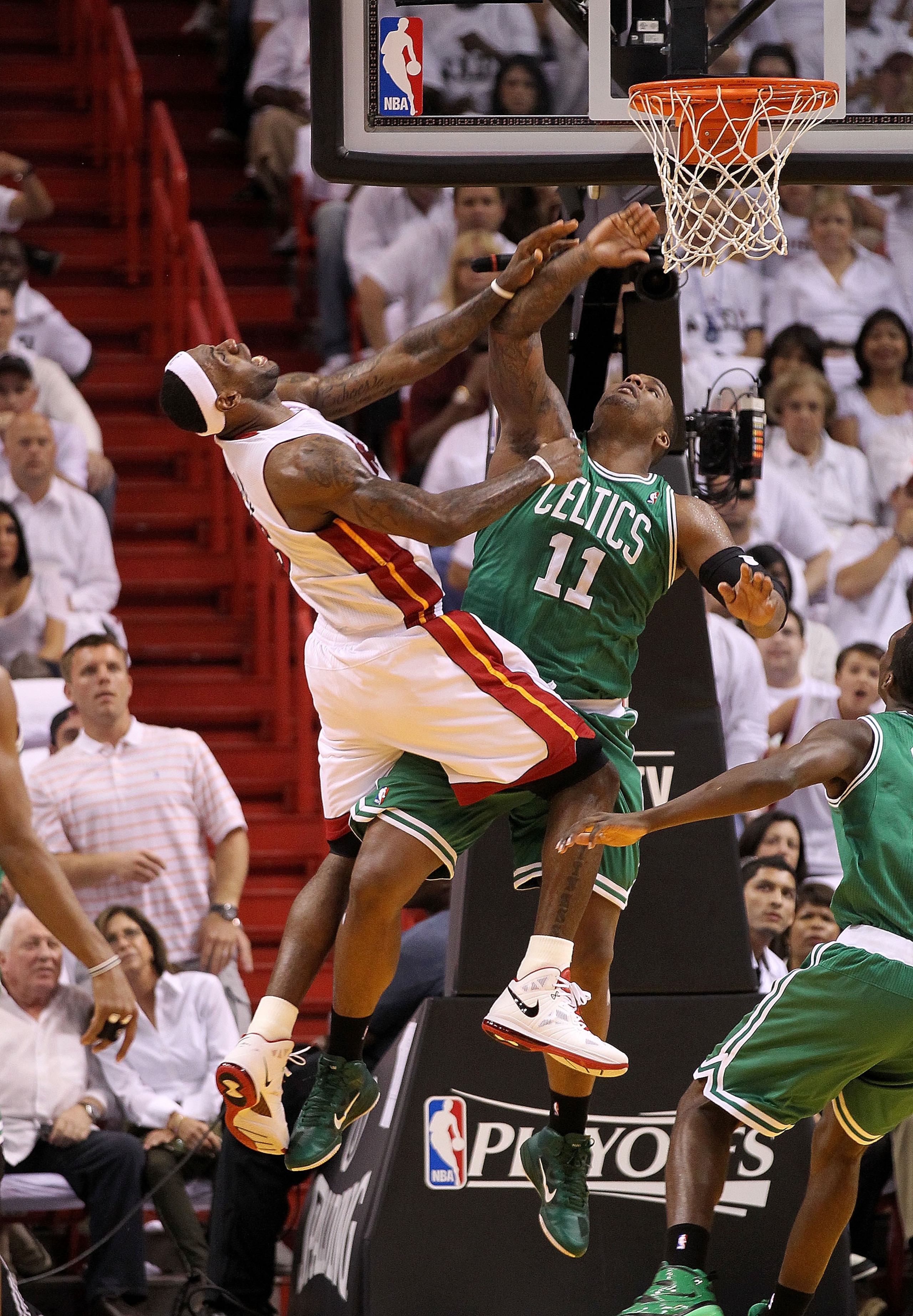 MIAMI, FL - MAY 03:  LeBron James #6 of the Miami Heat is fouled by Glen Davis #11 of the Boston Celtics during Game Two of the Eastern Conference Semifinals of the 2011 NBA Playoffs at American Airlines Arena on May 3, 2011 in Miami, Florida. NOTE TO USE