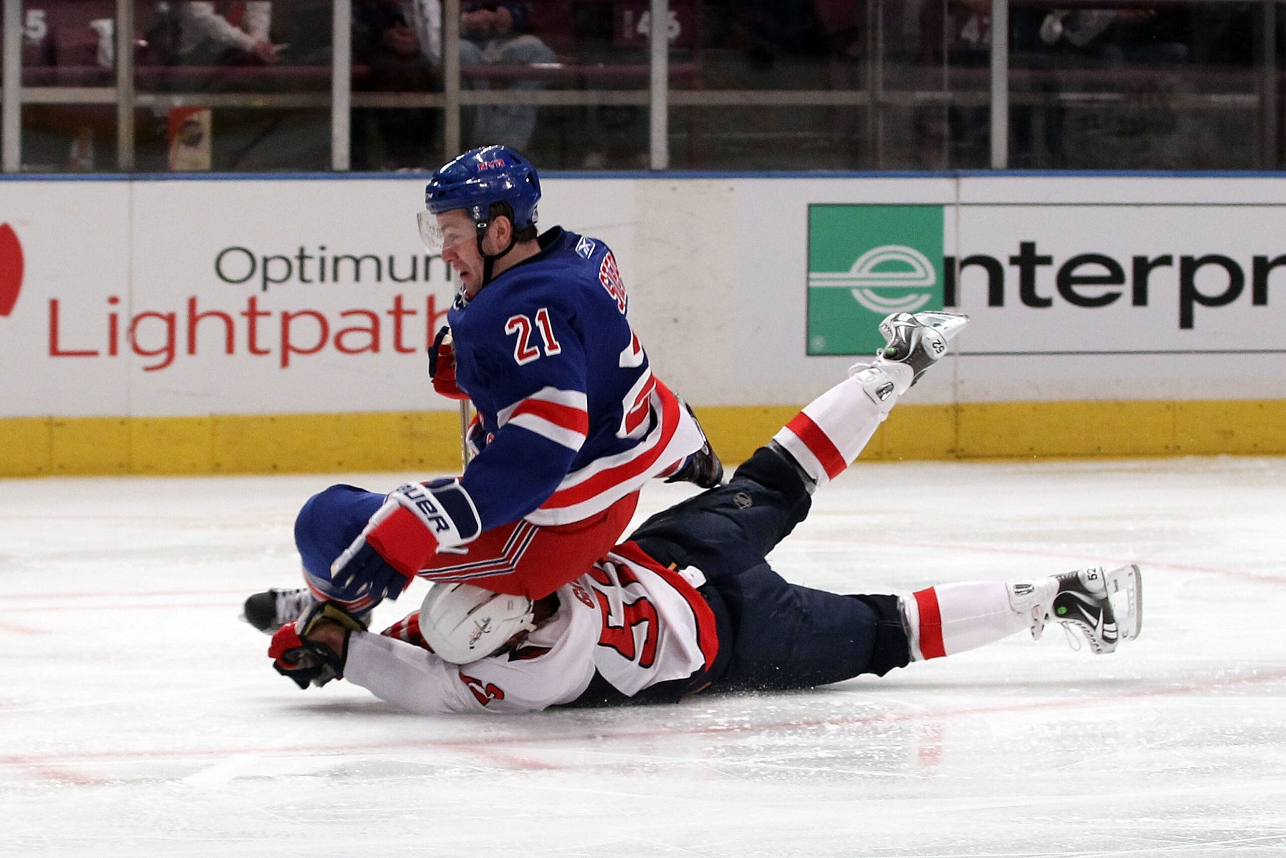 NEW YORK, NY - APRIL 20: Derek Stepan #21 of the New York Rangers falls to the ice as he was tripped up by Mike Green #52 of the Washington Capitals in Game Four of the Eastern Conference Quarterfinals during the 2011 NHL Stanley Cup Playoffs at Madison NEW YORK, NY - APRIL 20: Derek Stepan #21 of the New York Rangers falls to the ice as he was tripped up by Mike Green #52 of the Washington Capitals in Game Four of the Eastern Conference Quarterfinals during the 2011 NHL Stanley Cup Playoffs at Madison