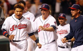 CLEVELAND - MAY 13:  Shin-Soo Choo #17 of the Cleveland Indians and members of his team celebrate following the walk-off two run home run by Travis Hafner #48 in the 9th inning against the Seattle Mariners during the game on May 13, 2011 at Progressive Fi