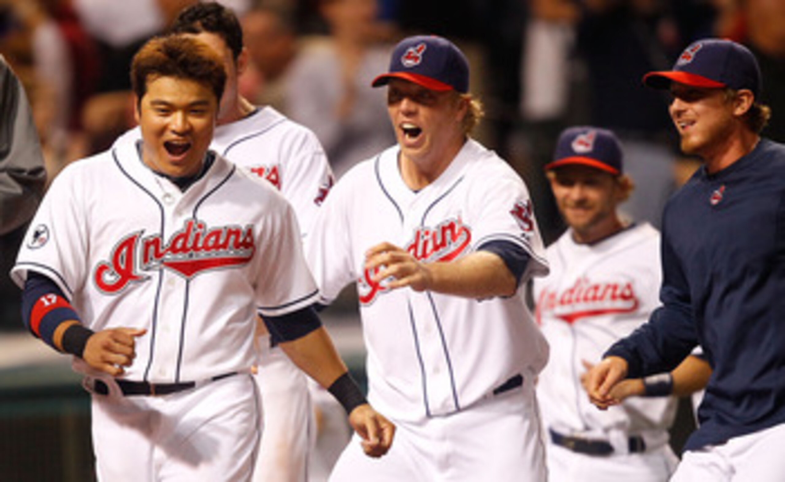 CLEVELAND - MAY 13:  Shin-Soo Choo #17 of the Cleveland Indians and members of his team celebrate following the walk-off two run home run by Travis Hafner #48 in the 9th inning against the Seattle Mariners during the game on May 13, 2011 at Progressive Fi