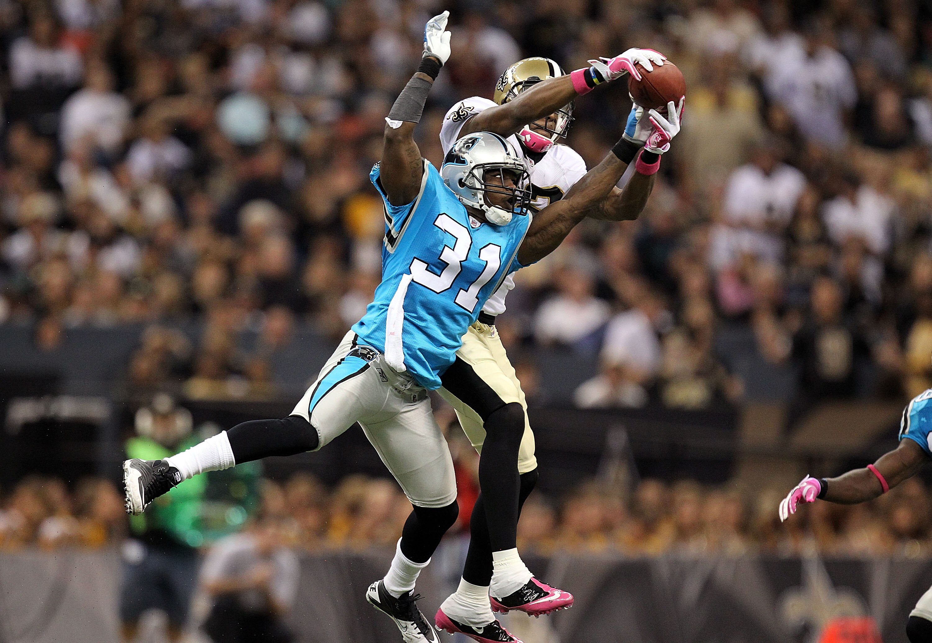 NEW ORLEANS - OCTOBER 03:  Cornerback Richard Marshall #31 of the Carolina Panthers breaks up a pass intended for Marques Colston #12 of the New Orleans Saints at the Louisiana Superdome on October 3, 2010 in New Orleans, Louisiana.  (Photo by Ronald Mart
