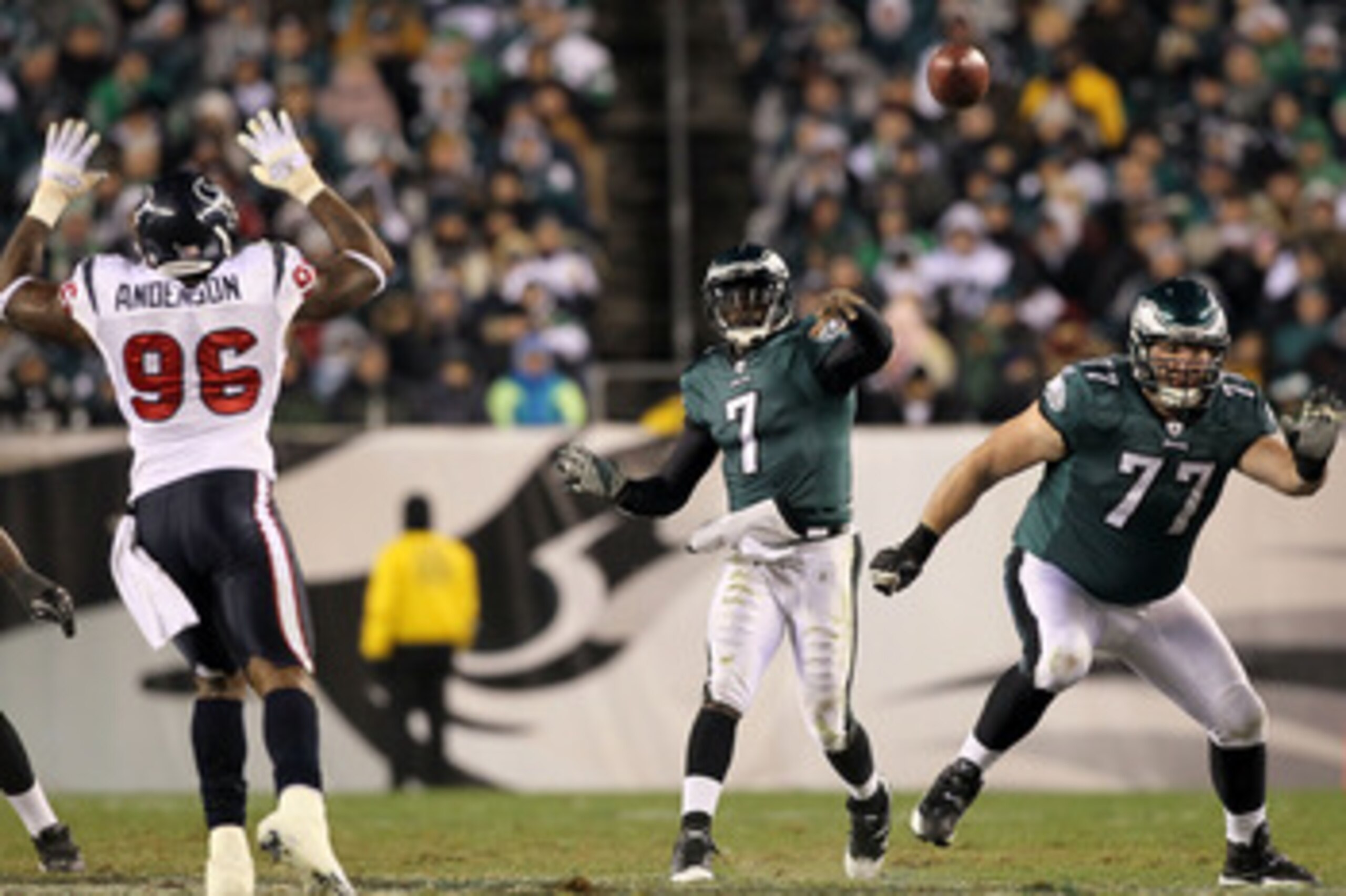 PHILADELPHIA, PA - DECEMBER 02:  Quarterback Michael Vick #7 of the Philadelphia Eagles passes the ball behind the blocking of Mike McGlynn #77 against the Houston Texans at Lincoln Financial Field on December 2, 2010 in Philadelphia, Pennsylvania.  (Phot