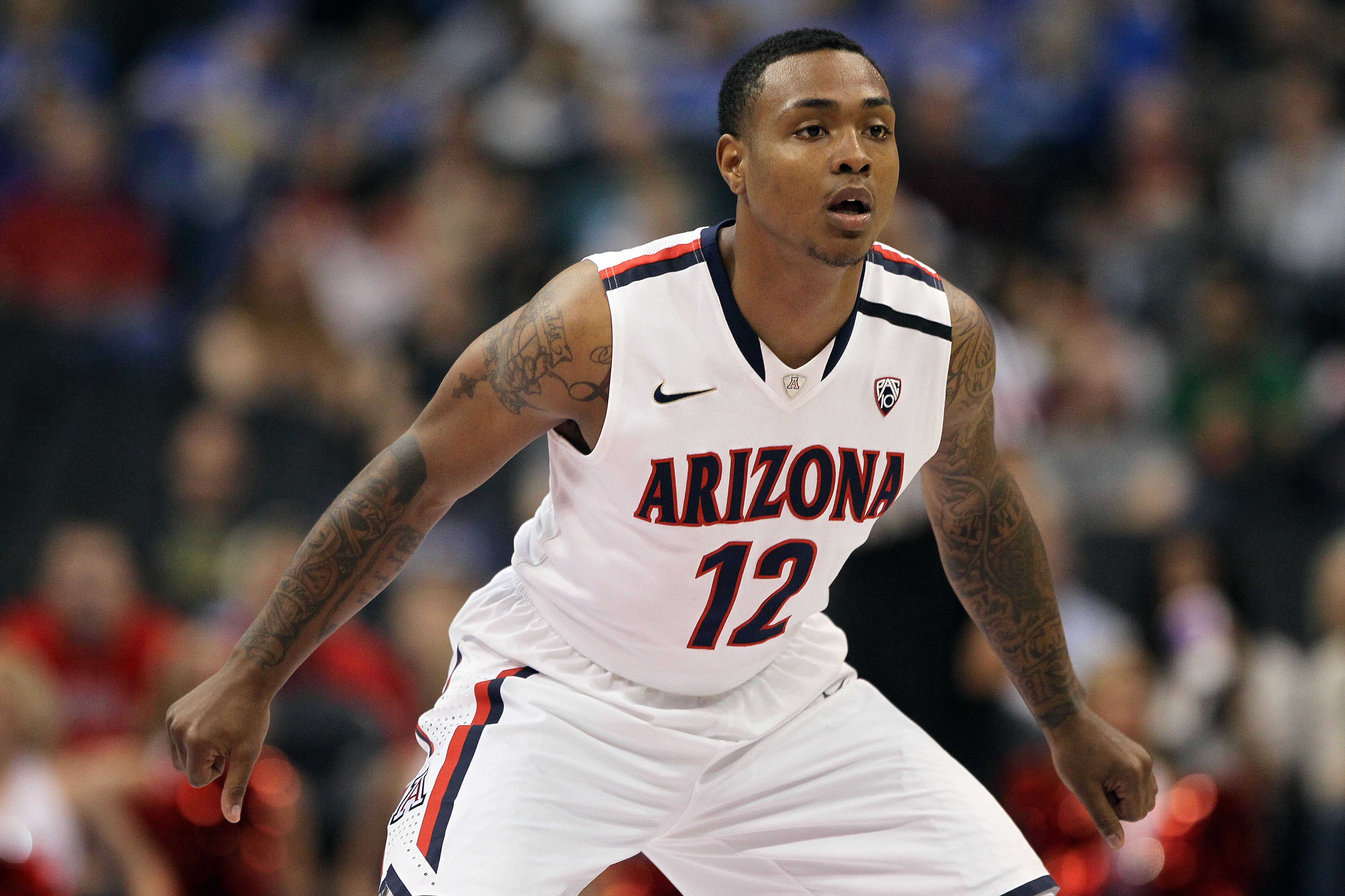 LOS ANGELES, CA - MARCH 10:  Lamont Jones #12 of the Arizona Wildcats plays defense in the first half against Oregon State Beavers in the quarterfinals of the 2011 Pacific Life Pac-10 Men's Basketball Tournament at Staples Center on March 10, 2011 in Los