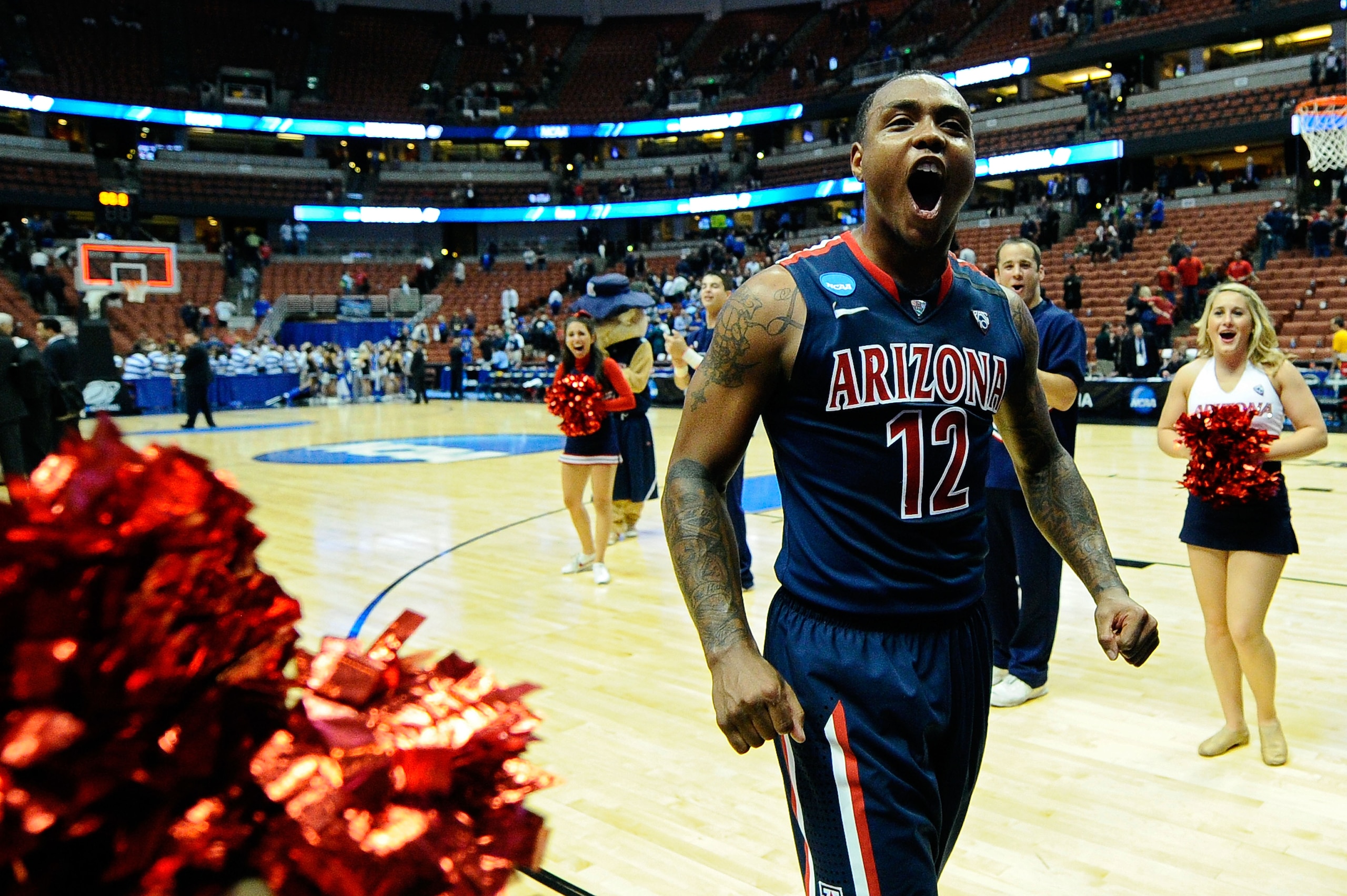 ANAHEIM, CA - MARCH 24: Lamont Jones #12 of the Arizona Wildcats celebrates after defeating the Duke Blue Devils during the west regional semifinal of the 2011 NCAA men's basketball tournament at the Honda Center on March 24, 2011 in Anaheim, California. ANAHEIM, CA - MARCH 24: Lamont Jones #12 of the Arizona Wildcats celebrates after defeating the Duke Blue Devils during the west regional semifinal of the 2011 NCAA men's basketball tournament at the Honda Center on March 24, 2011 in Anaheim, California.