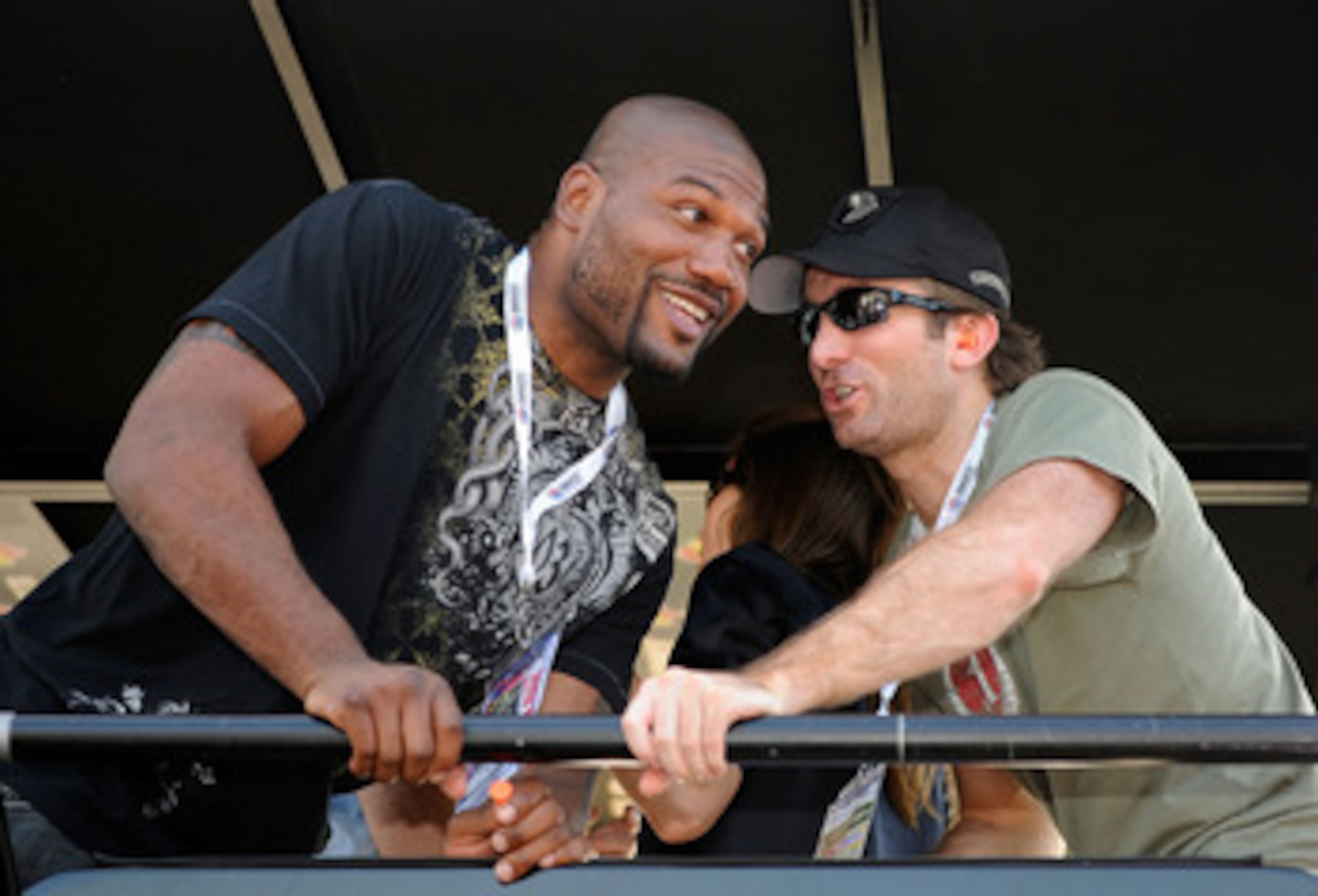 CONCORD, NC - MAY 30:  Actors Sharlto Copley (R) and Quinton 'Rampage' Jackson talk in the #39 U.S. Army Chevrolet pit box prior to the NASCAR Sprint Cup Series Coca-Cola 600 at Charlotte Motor Speedway on May 30, 2010 in Concord, North Carolina.  (Photo