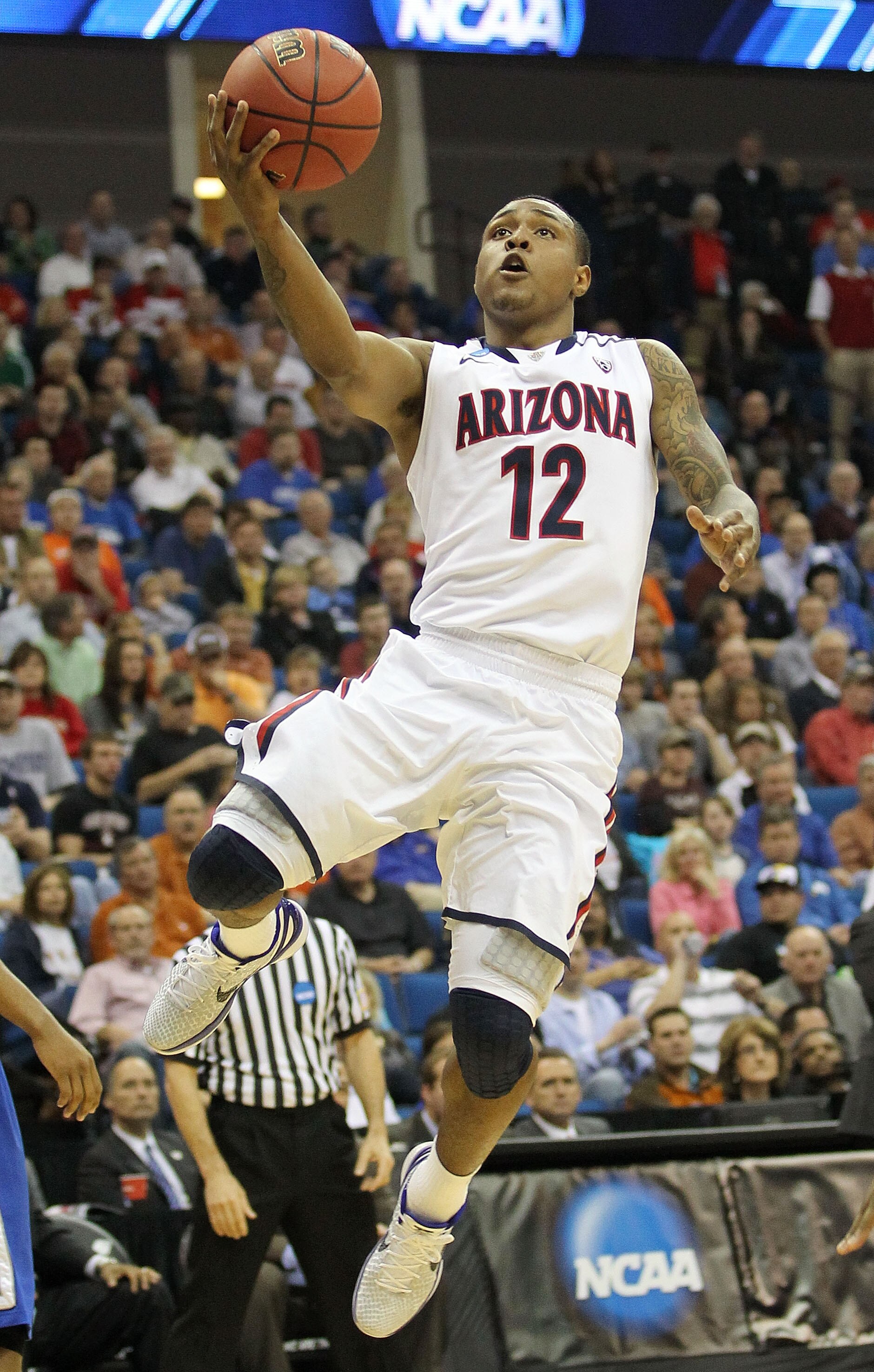 TULSA, OK - MARCH 18:  Lamont Jones #12 of the Arizona Wildcats goes up for a shot against the Memphis Tigers during the second round of the 2011 NCAA men's basketball tournament at BOK Center on March 18, 2011 in Tulsa, Oklahoma.  (Photo by Ronald Martin