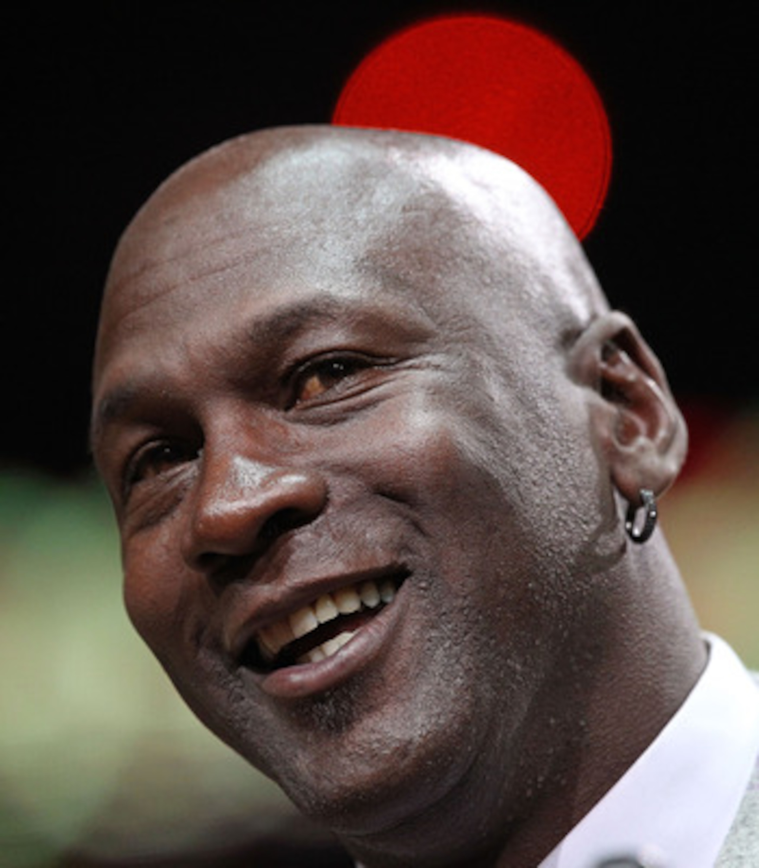 CHICAGO, IL - MARCH 12: Former player Michael Jordan of the Chicago Bulls addresses the crowd during a 20th anniversary recognition ceremony of the Bulls 1st NBA Championship in 1991 during half-time of a game bewteen the Bulls and the Utah Jazz at the Un