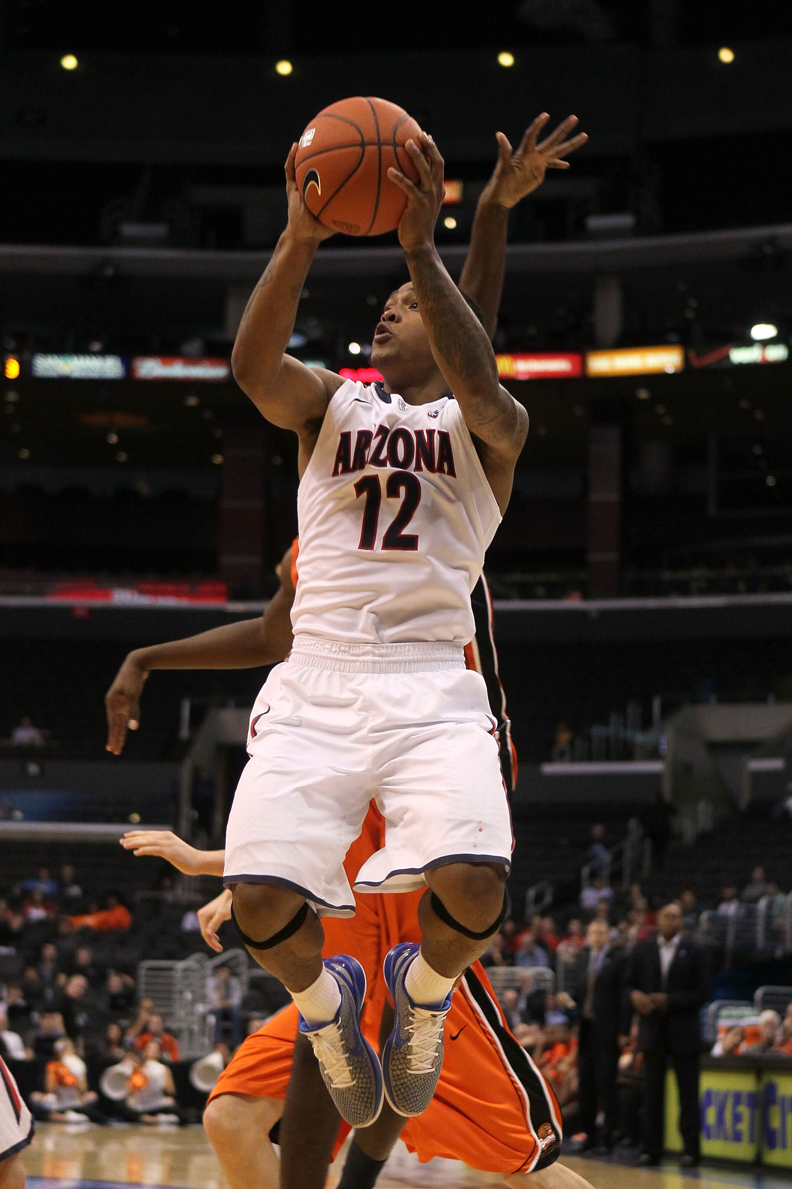 LOS ANGELES, CA - MARCH 10:  Lamont Jones #12 of the Arizona Wildcats goes up for a shot in the second half while taking on the Oregon State Beavers in the quarterfinals of the 2011 Pacific Life Pac-10 Men's Basketball Tournament at Staples Center on Marc