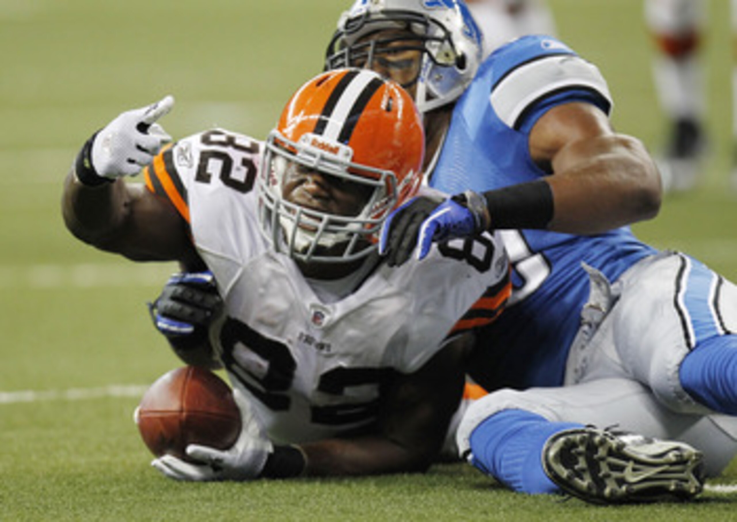 DETROIT - AUGUST 28:  Benjamin Watson #82 of the Cleveland Browns signals a first down to the official after being tackled by Julian Peterson #59 of the Detroit Lions during a preseason game on August 28, 2010 at Ford Field in Detroit, Michigan.  (Photo b