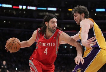 LOS ANGELES, CA - FEBRUARY 01:  Luis Scola #4 of the Houston Rockets is defended by Pau Gasol #16 of the Los Angeles Lakers in the second half at Staples Center on February 1, 2011 in Los Angeles, California. The Lakers defeated the Rockets 114-106. NOTE 