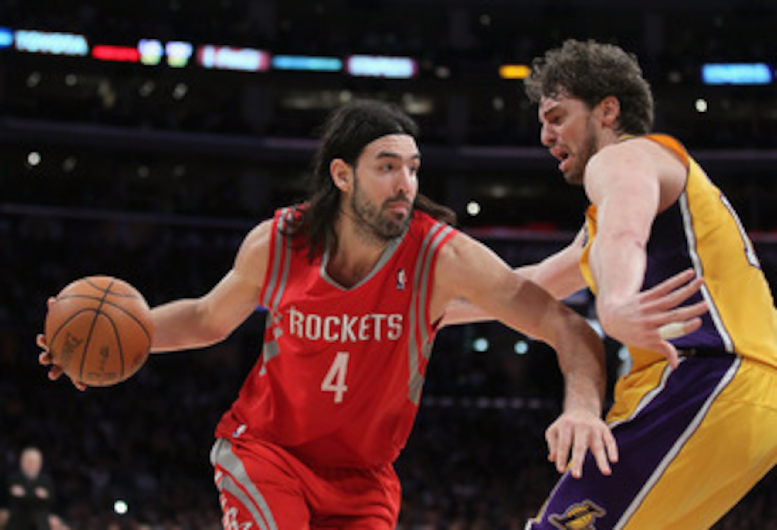 LOS ANGELES, CA - FEBRUARY 01:  Luis Scola #4 of the Houston Rockets is defended by Pau Gasol #16 of the Los Angeles Lakers in the second half at Staples Center on February 1, 2011 in Los Angeles, California. The Lakers defeated the Rockets 114-106. NOTE 