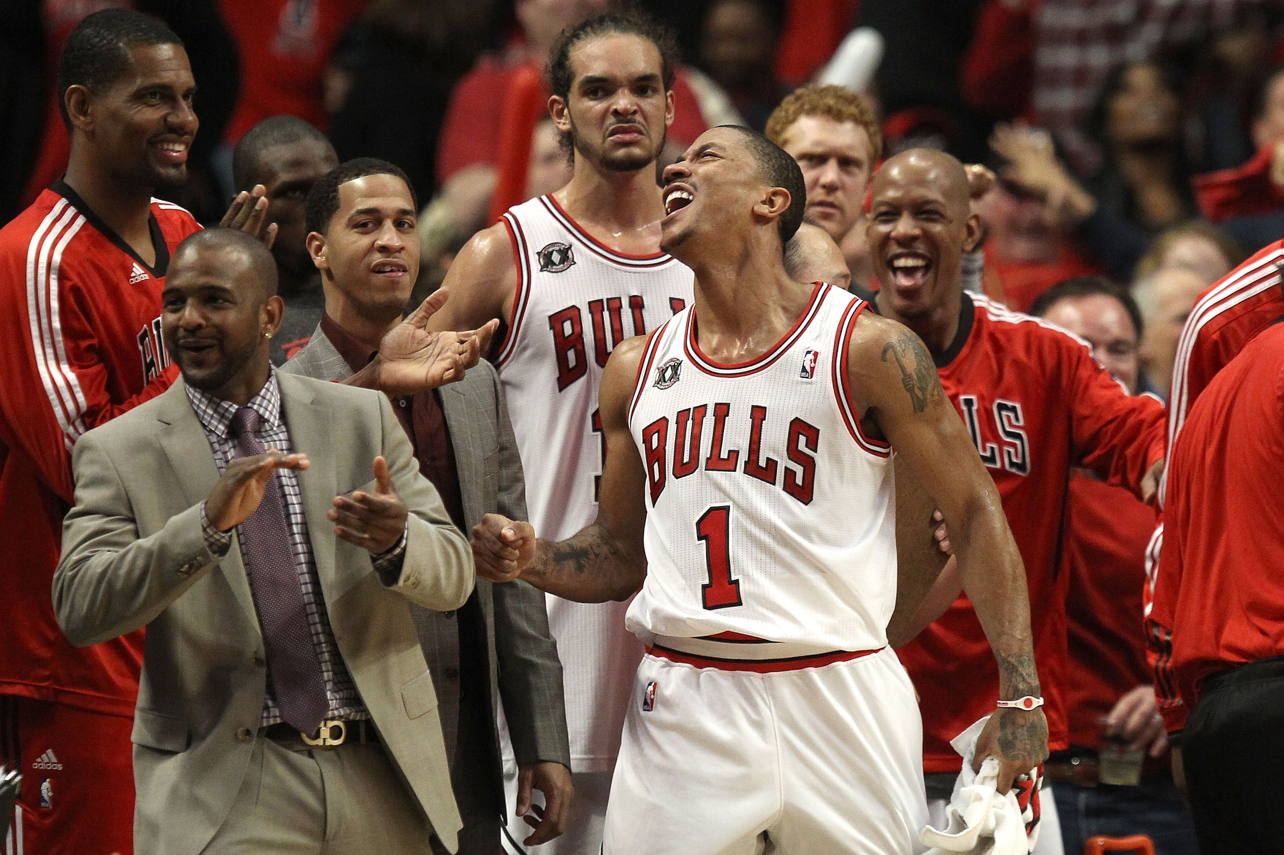 CHICAGO, IL - MAY 15:  (L-R) Kurt Thomas #40, John Lucas III, Joakim Noah #13, Derrick Rose #1 and Keith Bogans #6 of the Chicago Bulls celebrate late in the fourth quarter against the Miami Heat in Game One of the Eastern Conference Finals during the 201