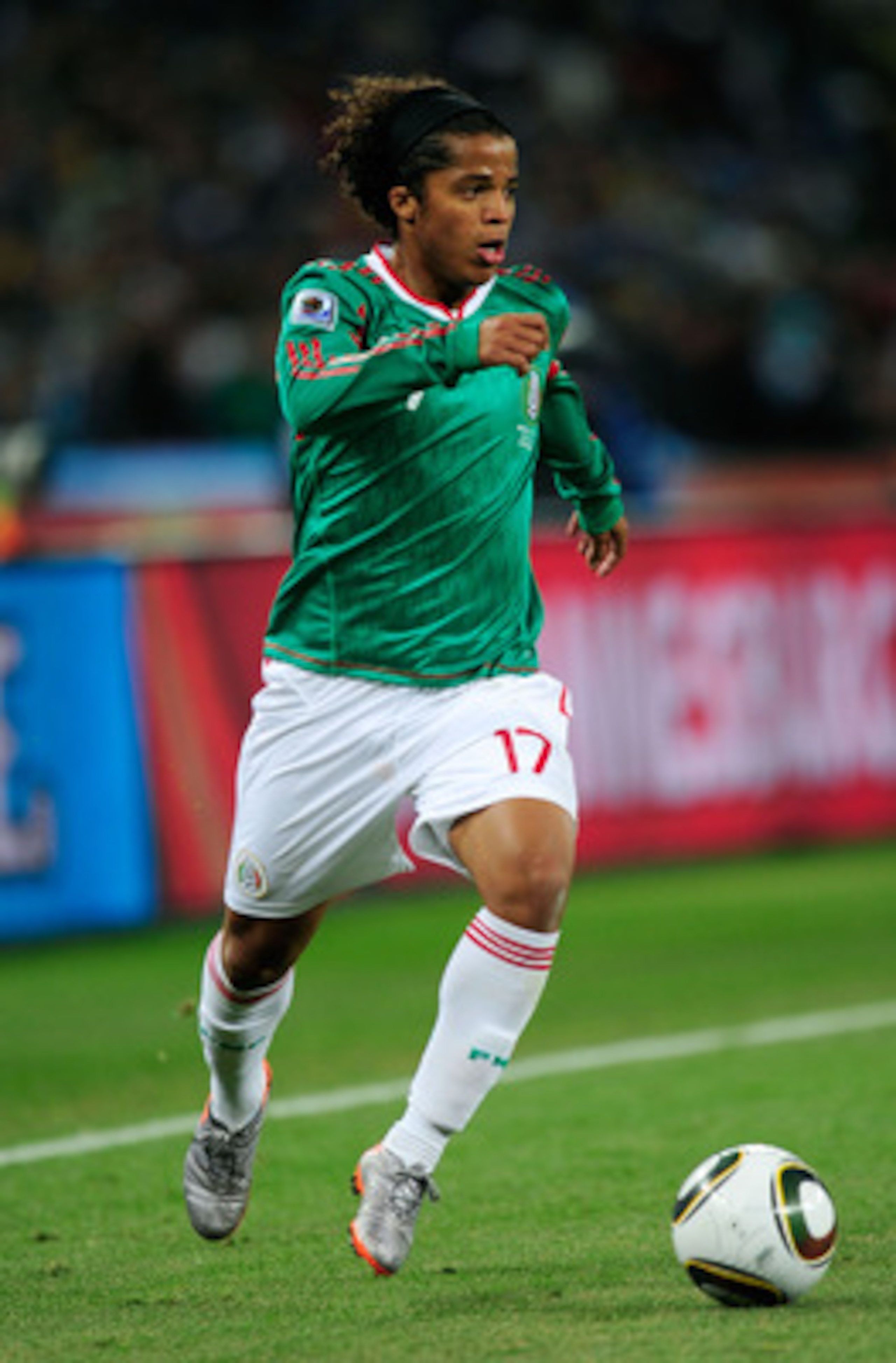 JOHANNESBURG, SOUTH AFRICA - JUNE 27:  Giovani Dos Santos of Mexico runs with the ball during the 2010 FIFA World Cup South Africa Round of Sixteen match between Argentina and Mexico at Soccer City Stadium on June 27, 2010 in Johannesburg, South Africa.