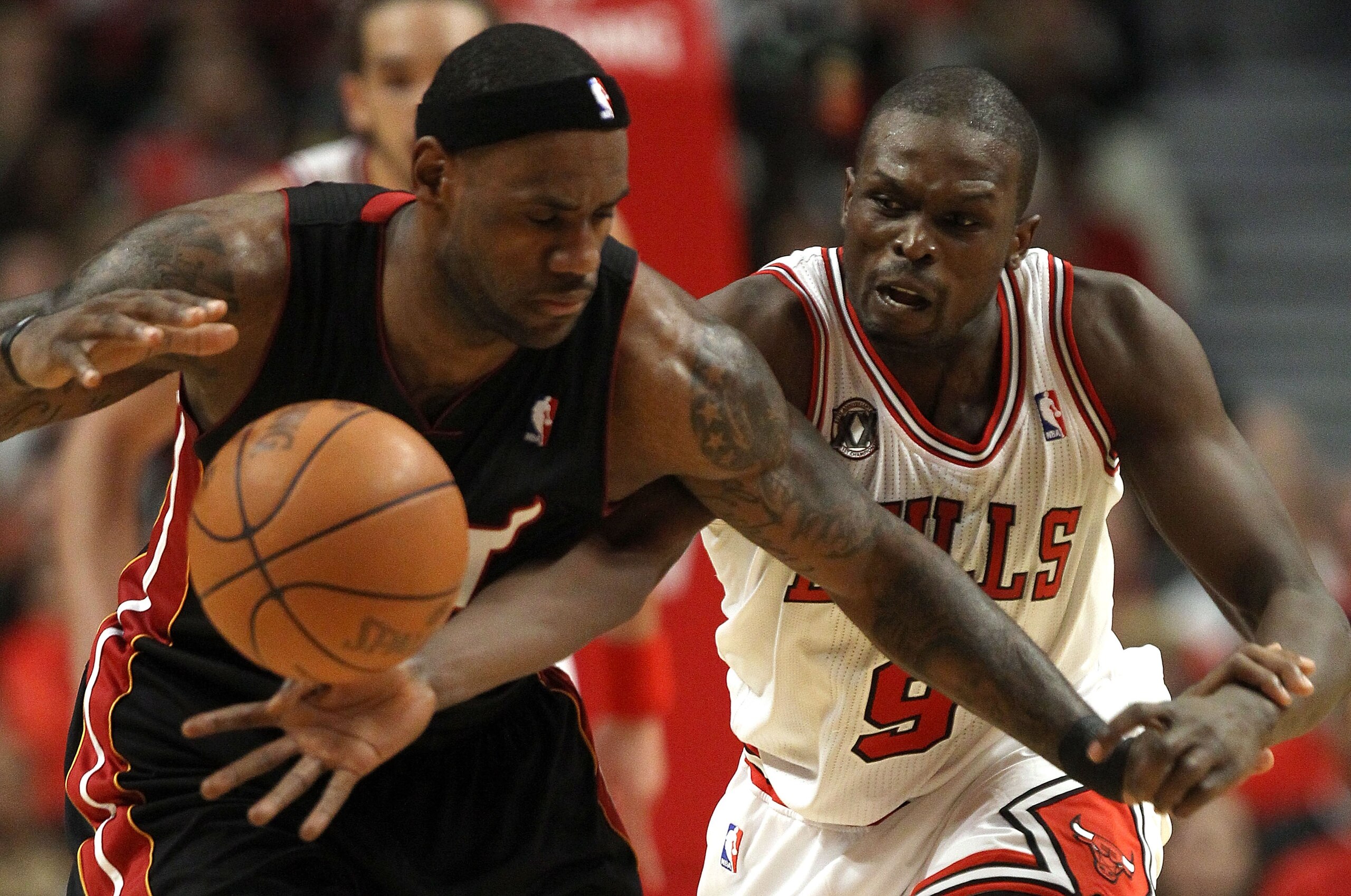 CHICAGO, IL - MAY 15:  Luol Deng #9 of the Chicago Bulls attempts to steal the ball from LeBron James #6 of the Miami Heat in Game One of the Eastern Conference Finals during the 2011 NBA Playoffs on May 15, 2011 at the United Center in Chicago, Illinois.