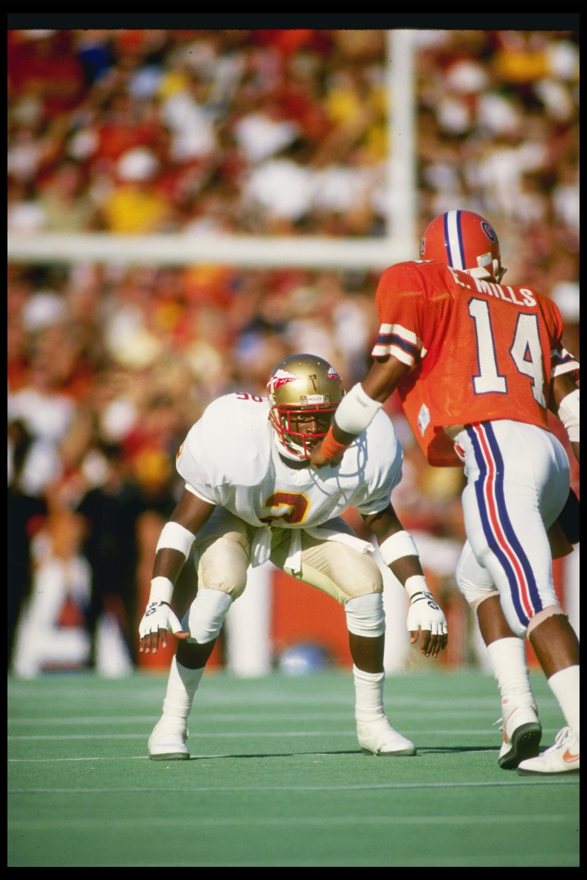 28 Nov 1987:  Cornerback Deion Sanders of the Florida State Seminoles covers wide receiver Ernie Mills of the Florida Gators at Florida Field in Gainesville, Florida.  Florida State won the game 28-14. Mandatory Credit: Allen Dean Steele  /Allsport