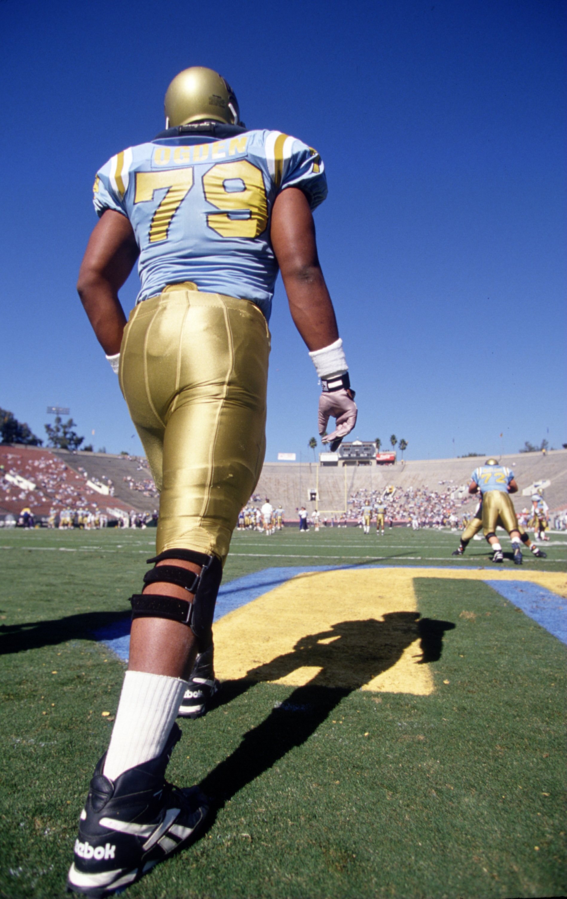 11 Nov 1995:  Offensive lineman Jonathan Ogden #79 of the UCLA Bruins stretches in the endzone during pre-game warm-ups before the Bruins 38-14 loss to the Washington Huskies at the Rose Bowl in Pasadena, California.   Mandatory Credit: Al Bello/ALLSPORT
