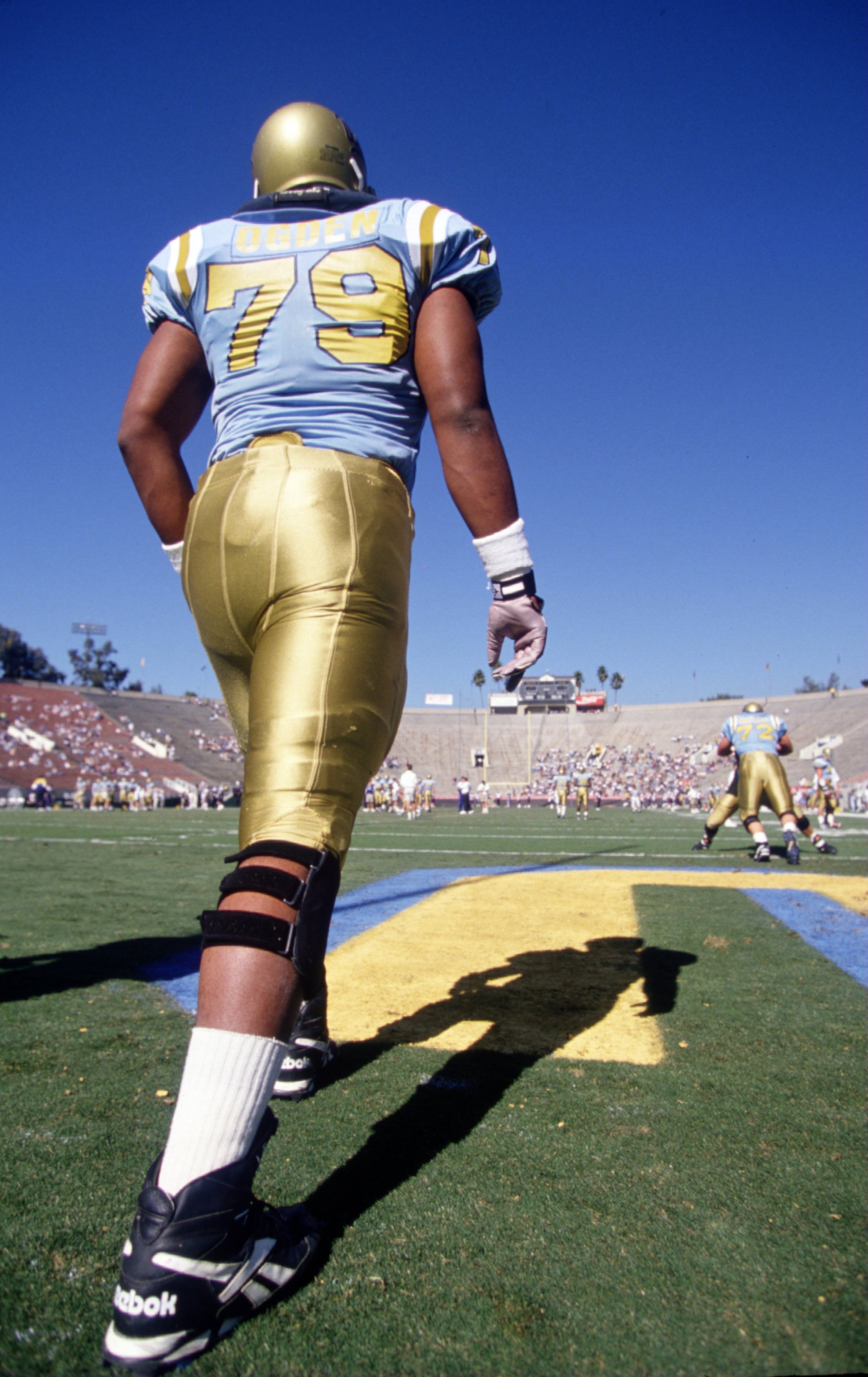 11 Nov 1995:  Offensive lineman Jonathan Ogden #79 of the UCLA Bruins stretches in the endzone during pre-game warm-ups before the Bruins 38-14 loss to the Washington Huskies at the Rose Bowl in Pasadena, California.   Mandatory Credit: Al Bello/ALLSPORT