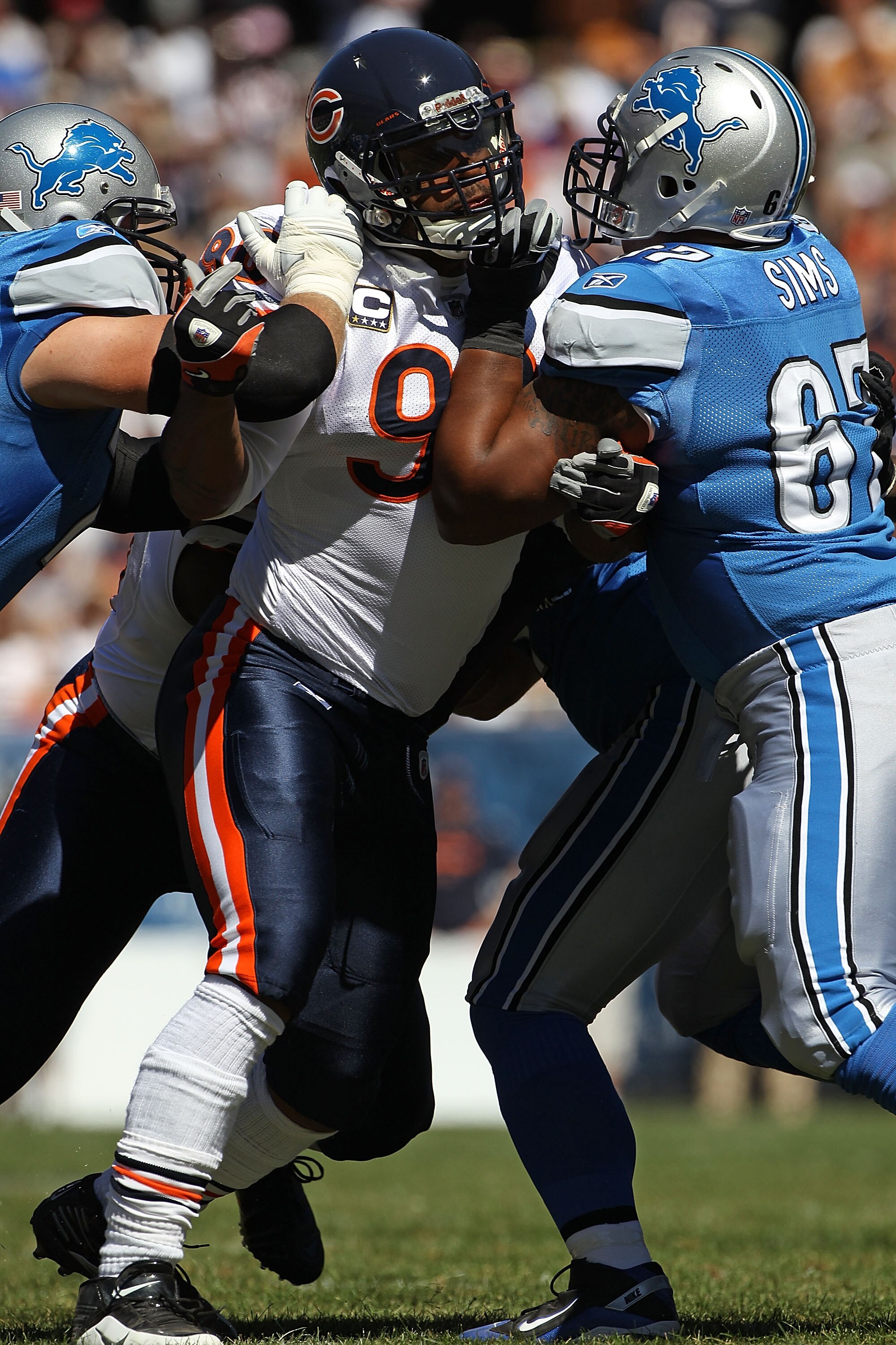 CHICAGO - SEPTEMBER 12: Julius Peppers #90 of the Chicago Bears rushes against Jeff Backus 76 (L) and Rob Sims #67 of the Detroit Lions during the NFL season opening game at Soldier Field on September 12, 2010 in Chicago, Illinois. (Photo by Jonathan Dani