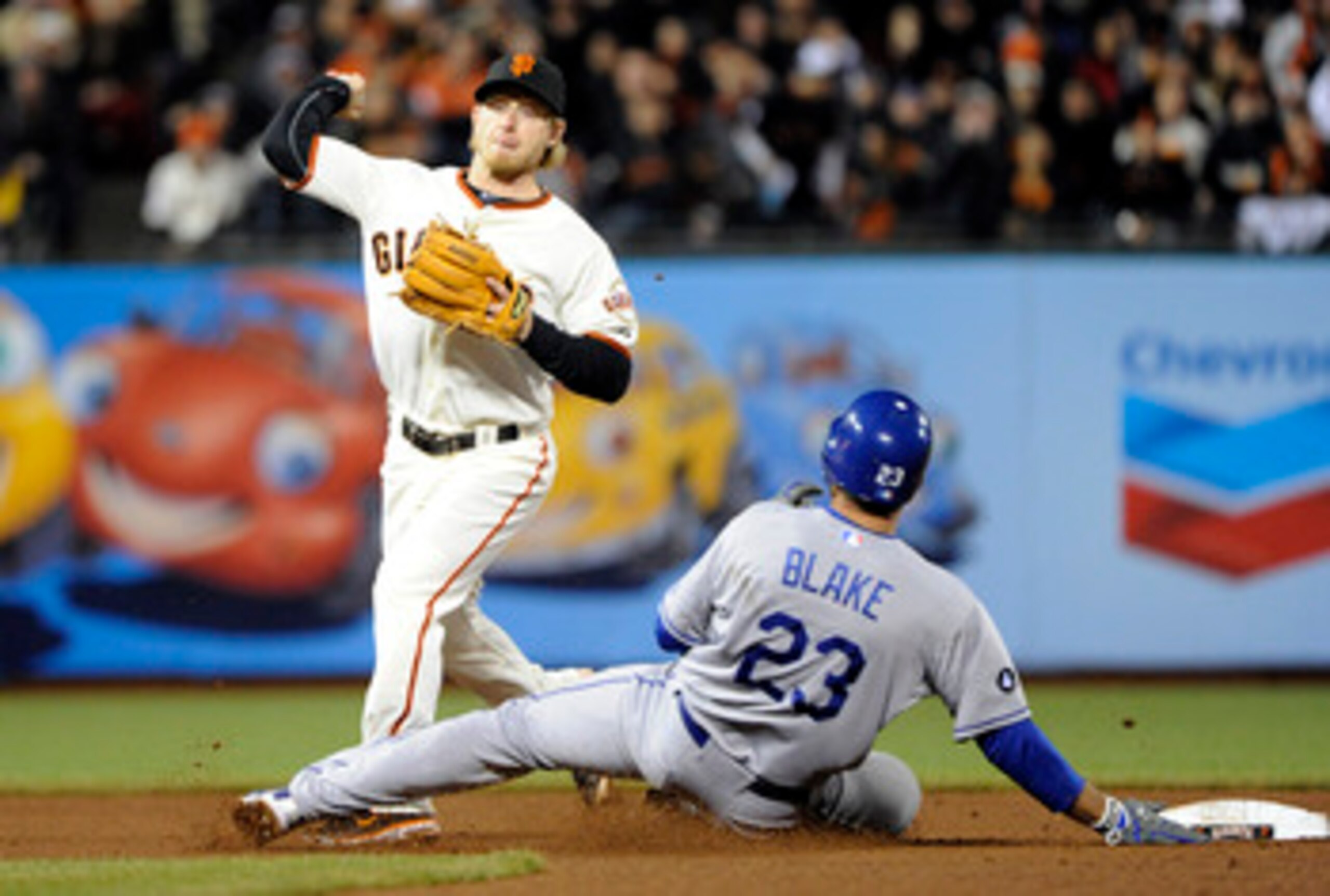 SAN FRANCISCO, CA - APRIL 13: Casey Blake #23 of the Los Angeles Dodgers slides into Mike Fontenot  #14 of the San Francisco Giants, breaking up a double play during a MLB baseball game at AT&T Park April 13, 2011 in San Francisco, California. (Photo by T