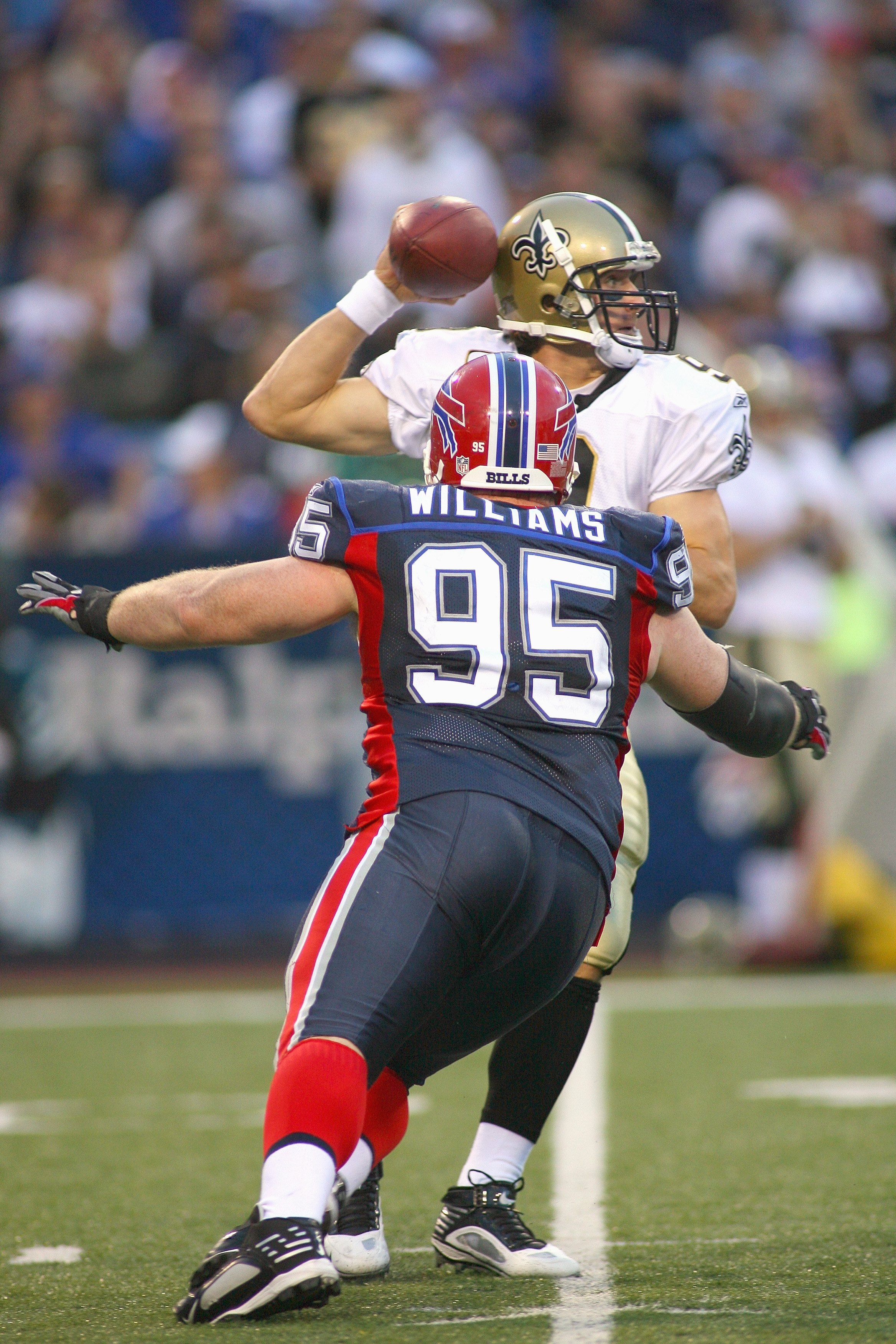 ORCHARD PARK, NY - SEPTEMBER 27:  Kyle Williams #95 of the Buffalo Bills moves to sack quarterback Drew Brees #9 of the New Orleans Saints at Ralph Wilson Stadium on September 27, 2009 in Orchard Park, New York. (Photo by Rick Stewart/Getty Images)