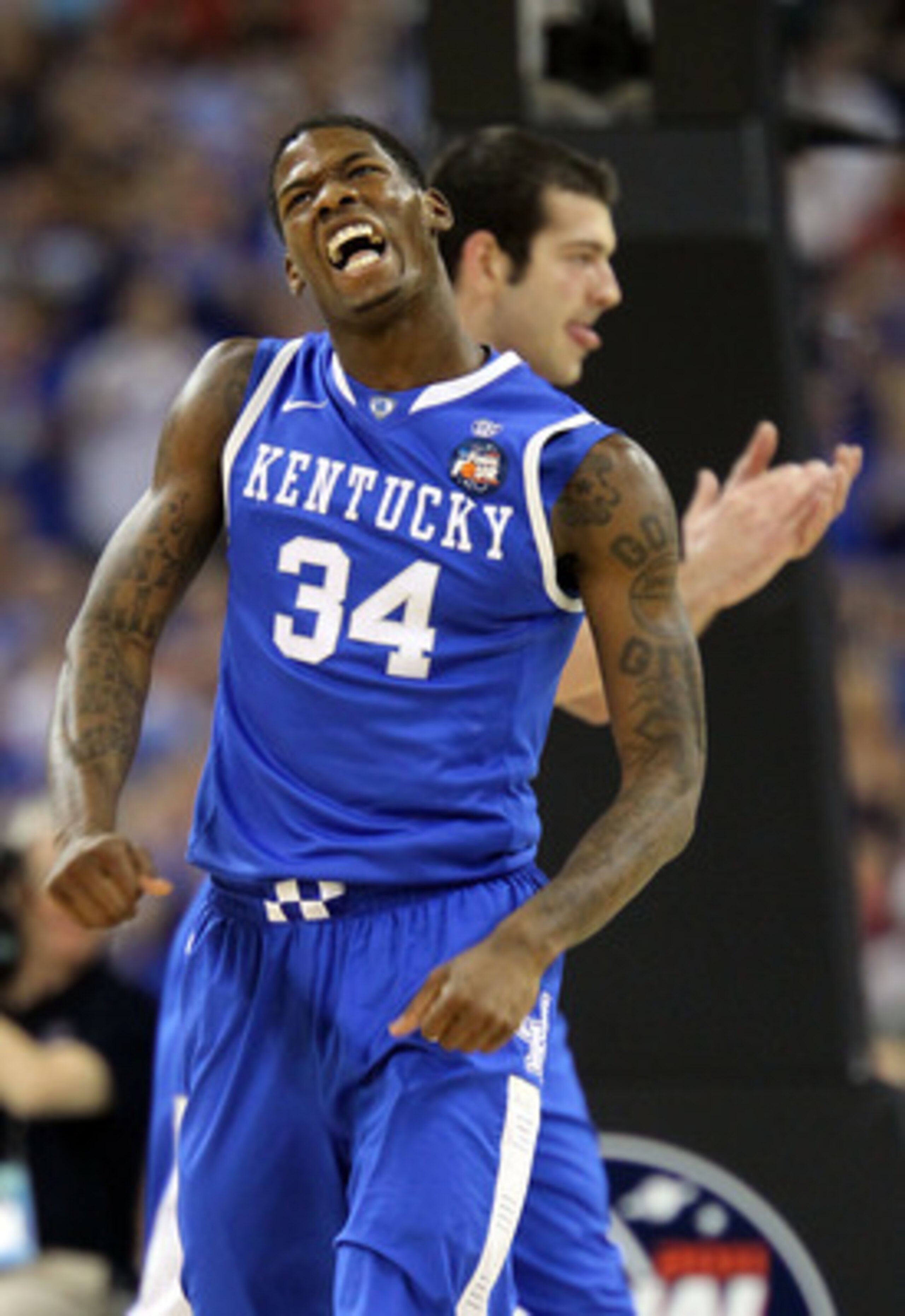 HOUSTON, TX - APRIL 02:  DeAndre Liggins #34 of the Kentucky Wildcats reacts after a play against the Connecticut Huskies during the National Semifinal game of the 2011 NCAA Division I Men's Basketball Championship at Reliant Stadium on April 2, 2011 in H