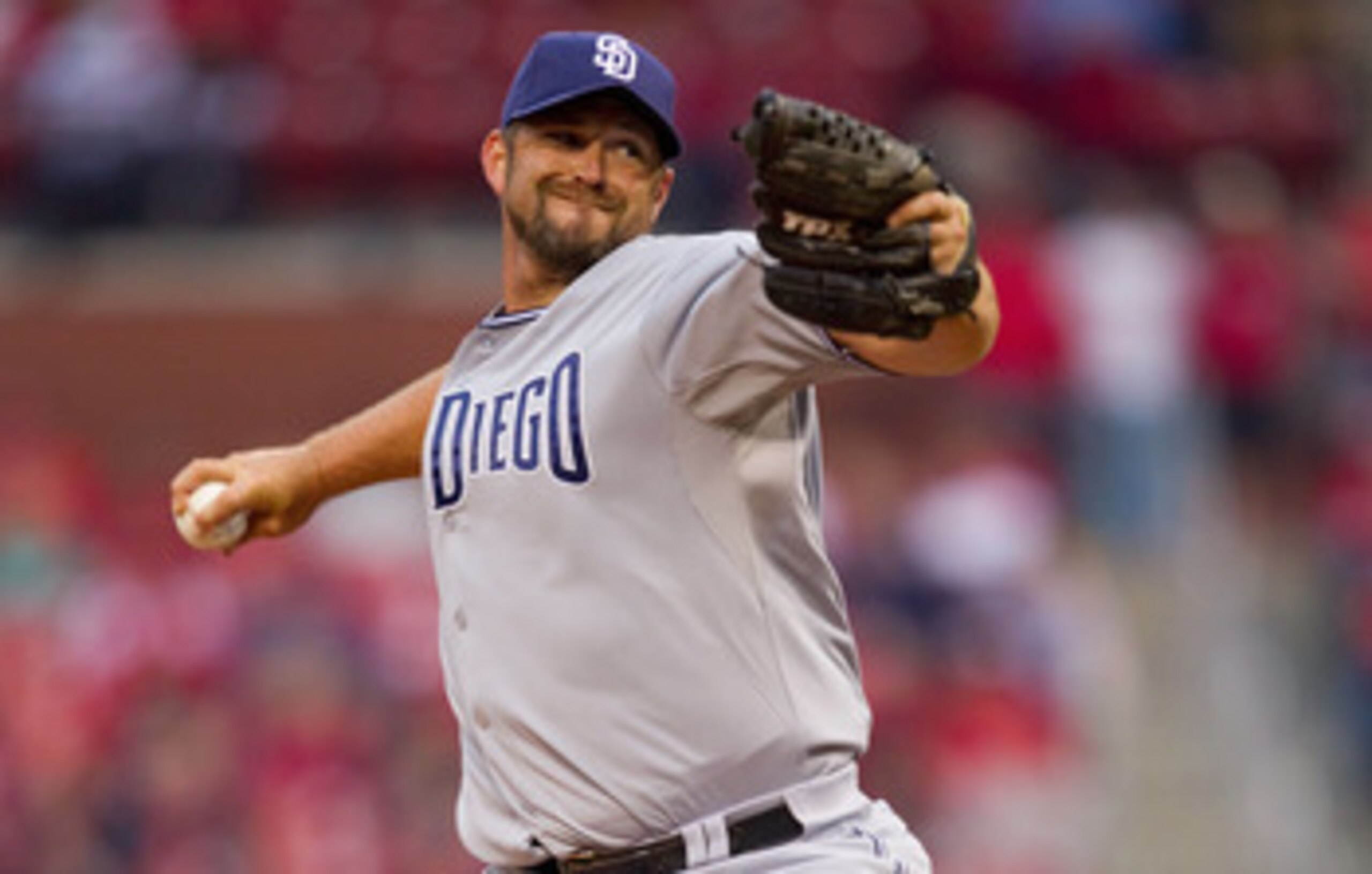 ST. LOUIS, MO - MARCH 31: Reliever Heath Bell #21 of the San Diego Padres pitches against the St. Louis Cardinals on opening day at Busch Stadium on March 31, 2011 in St. Louis, Missouri.  (Photo by Dilip Vishwanat/Getty Images)