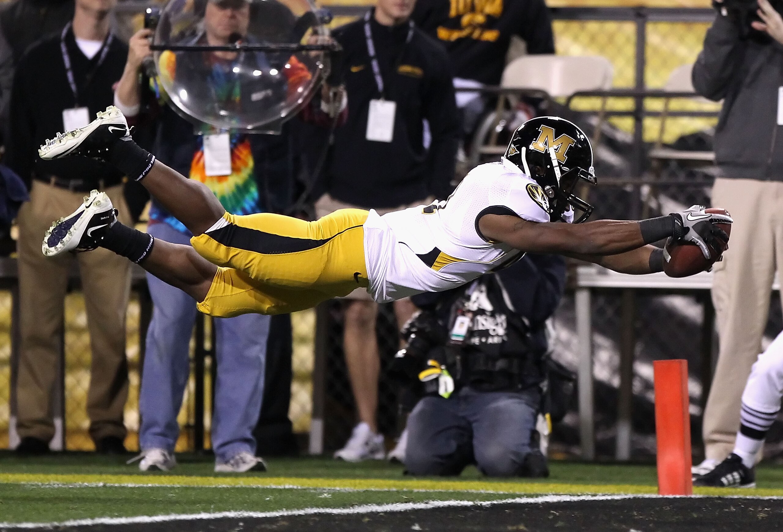 TEMPE, AZ - DECEMBER 28:  Runningback Henry Josey #41 of the Missouri Tigers dives into the endzone to score on a 10 yard rushing touchdown against the Iowa Hawkeyes during the second quarter of the Insight Bowl at Sun Devil Stadium on December 28, 2010 i