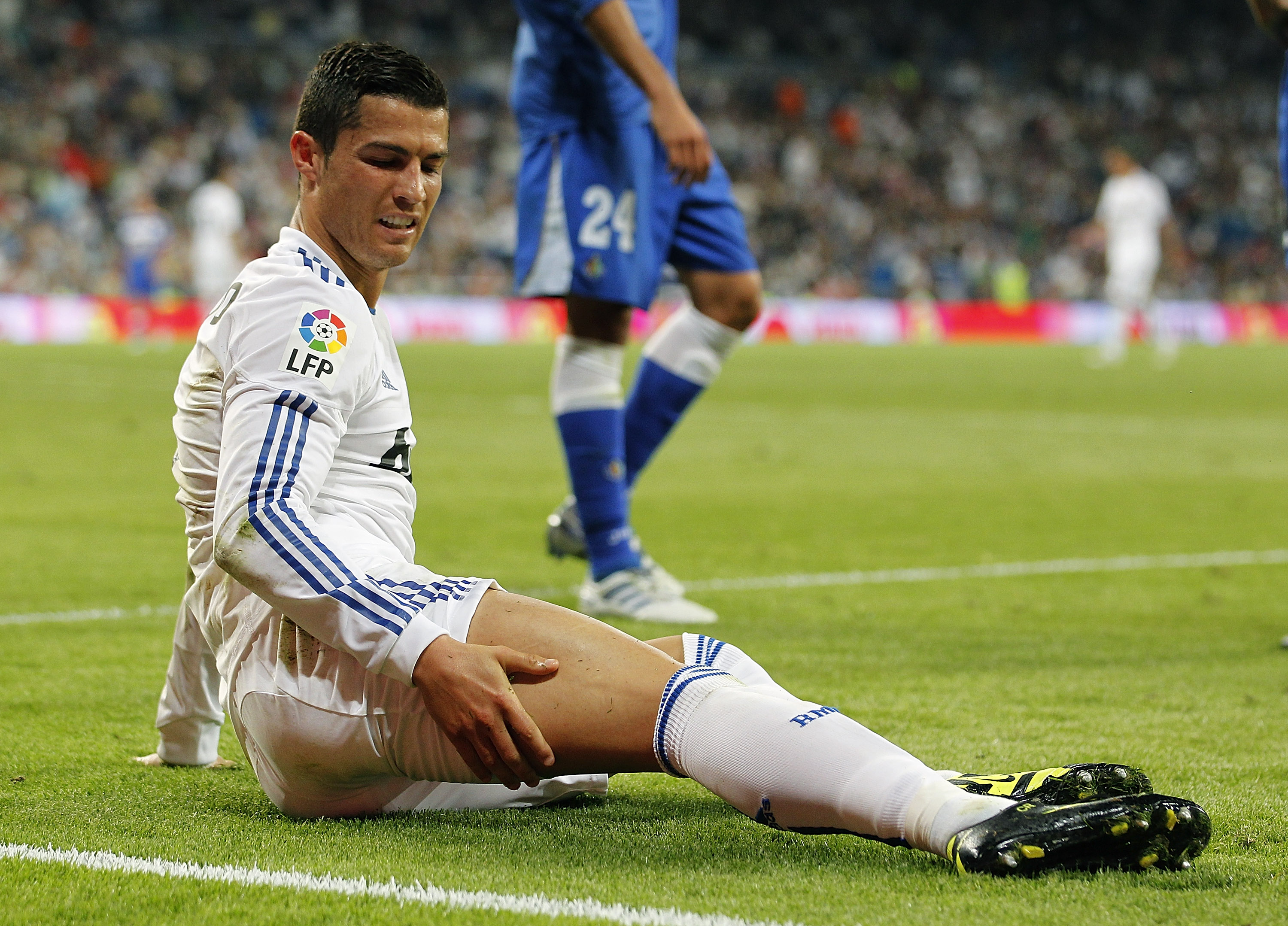 MADRID, SPAIN - MAY 10:  Cristiano Ronaldo of Real Madrid grimaces during the La Liga match between Real Madrid and Getafe at Estadio Santiago Bernabeu on May 10, 2011 in Madrid, Spain.  (Photo by Angel Martinez/Getty Images)