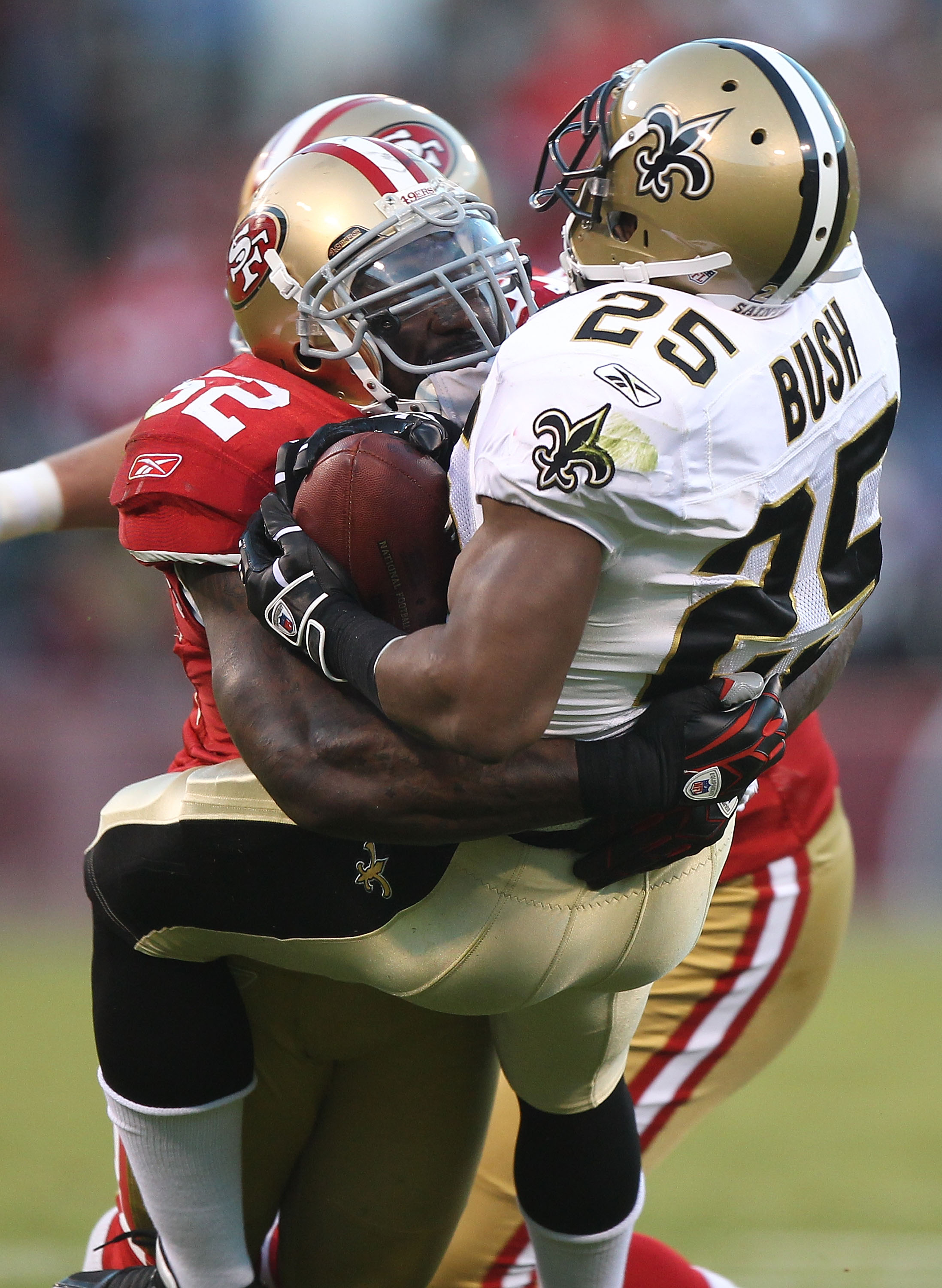 SAN FRANCISCO - SEPTEMBER 20:  Patrick Willis #52 of the San Francisco 49er tackles Reggie Bush #25 of the New Orleans Saints during an NFL game at Candlestick Park on September 20, 2010 in San Francisco, California.(Photo by Jed Jacobsohn/Getty Images)