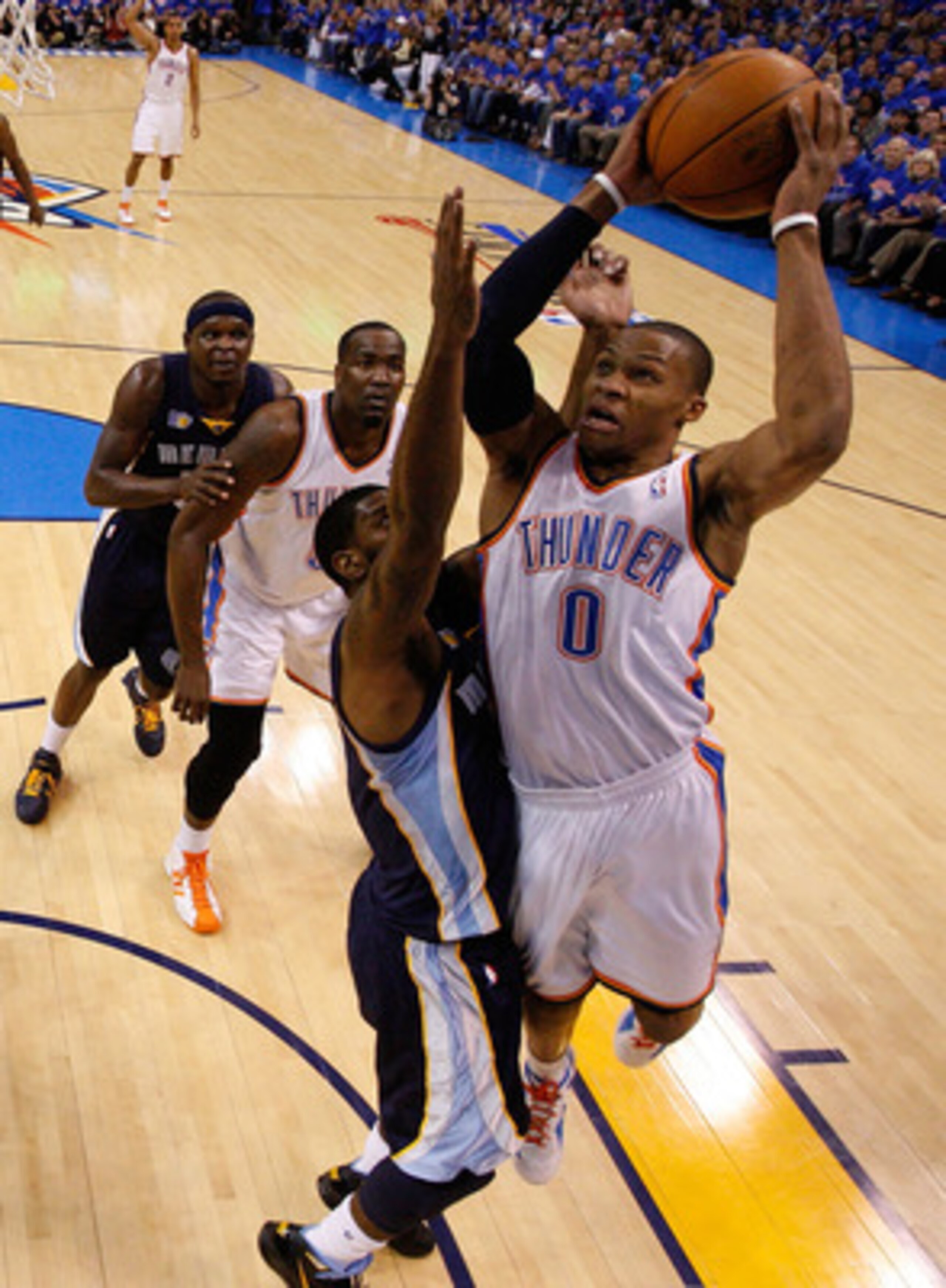 OKLAHOMA CITY, OK - MAY 15:  Guard Russell Westbrook #0 of the Oklahoma City Thunder takes a shot against O.J. Mayo #33 of the Memphis Grizzlies in Game Seven of the Western Conference Semifinals in the 2011 NBA Playoffs on May 15, 2011 at Oklahoma City A