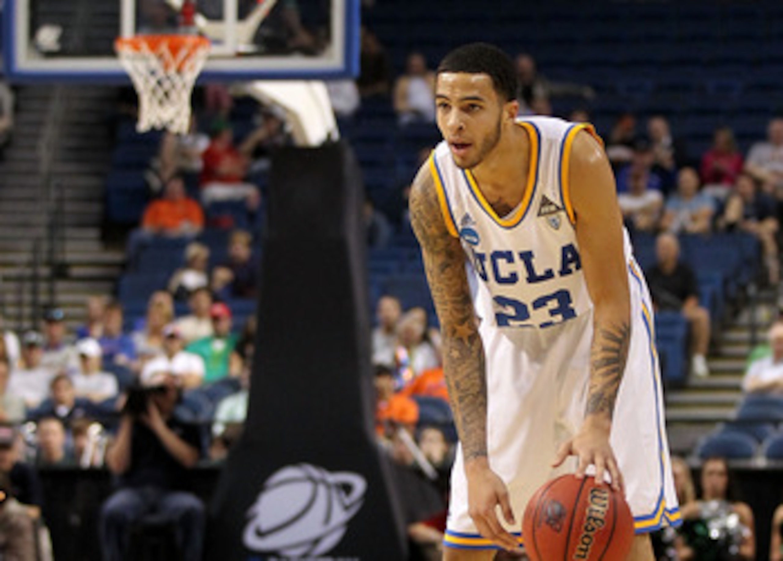 TAMPA, FL - MARCH 17:  Tyler Honeycutt #23 of the UCLA Bruins looks to pass the ball against the Michigan State Spartans during the second round of the 2011 NCAA men's basketball tournament at St. Pete Times Forum on March 17, 2011 in Tampa, Florida. UCLA