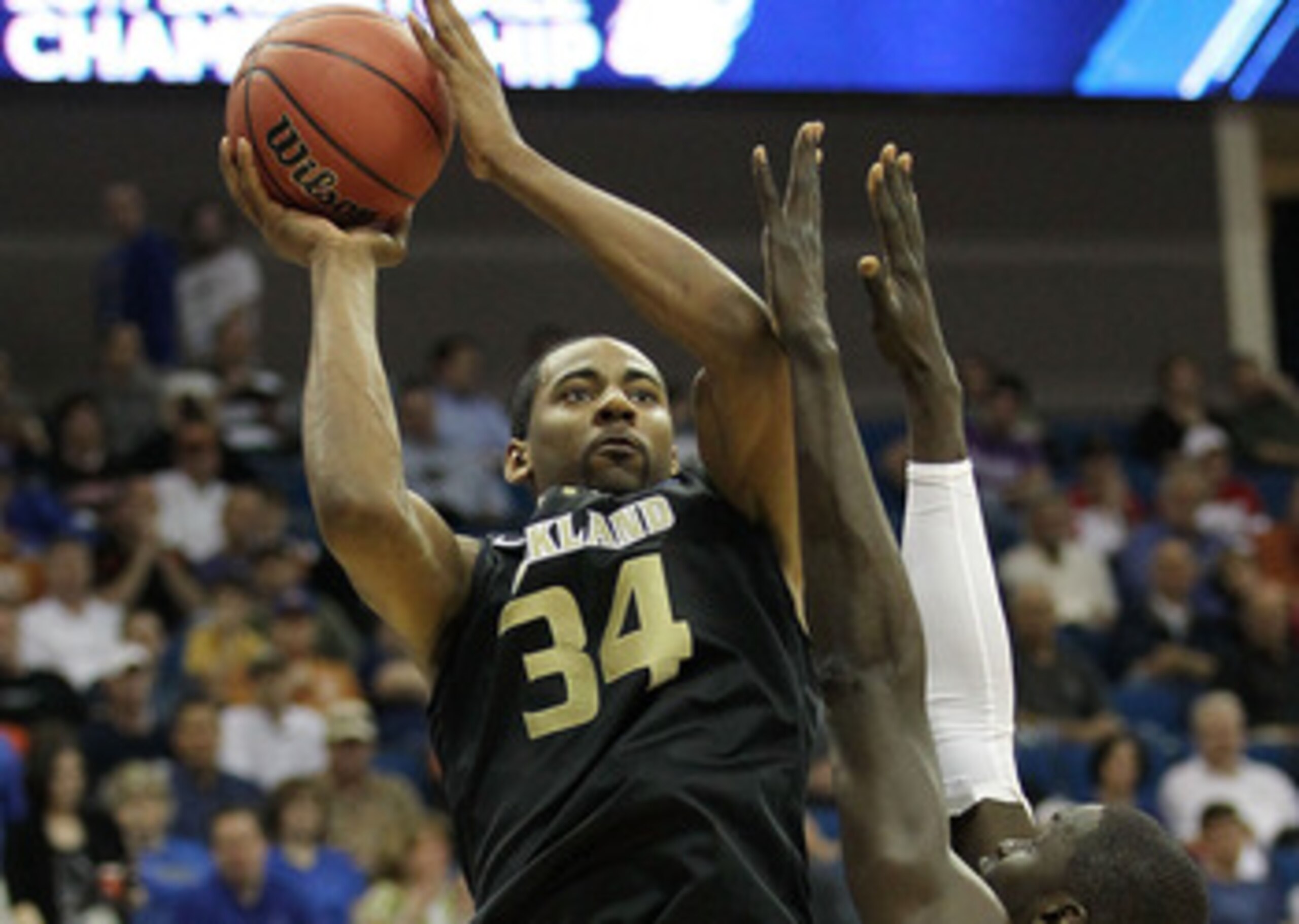 TULSA, OK - MARCH 18:  Keith Benson #34 of the Oakland Golden Grizzlies goes up for a shot against Alexis Wangmene #20 of the Texas Longhorns during the second round game of the 2011 NCAA men's basketball tournament at BOK Center on March 18, 2011 in Tuls