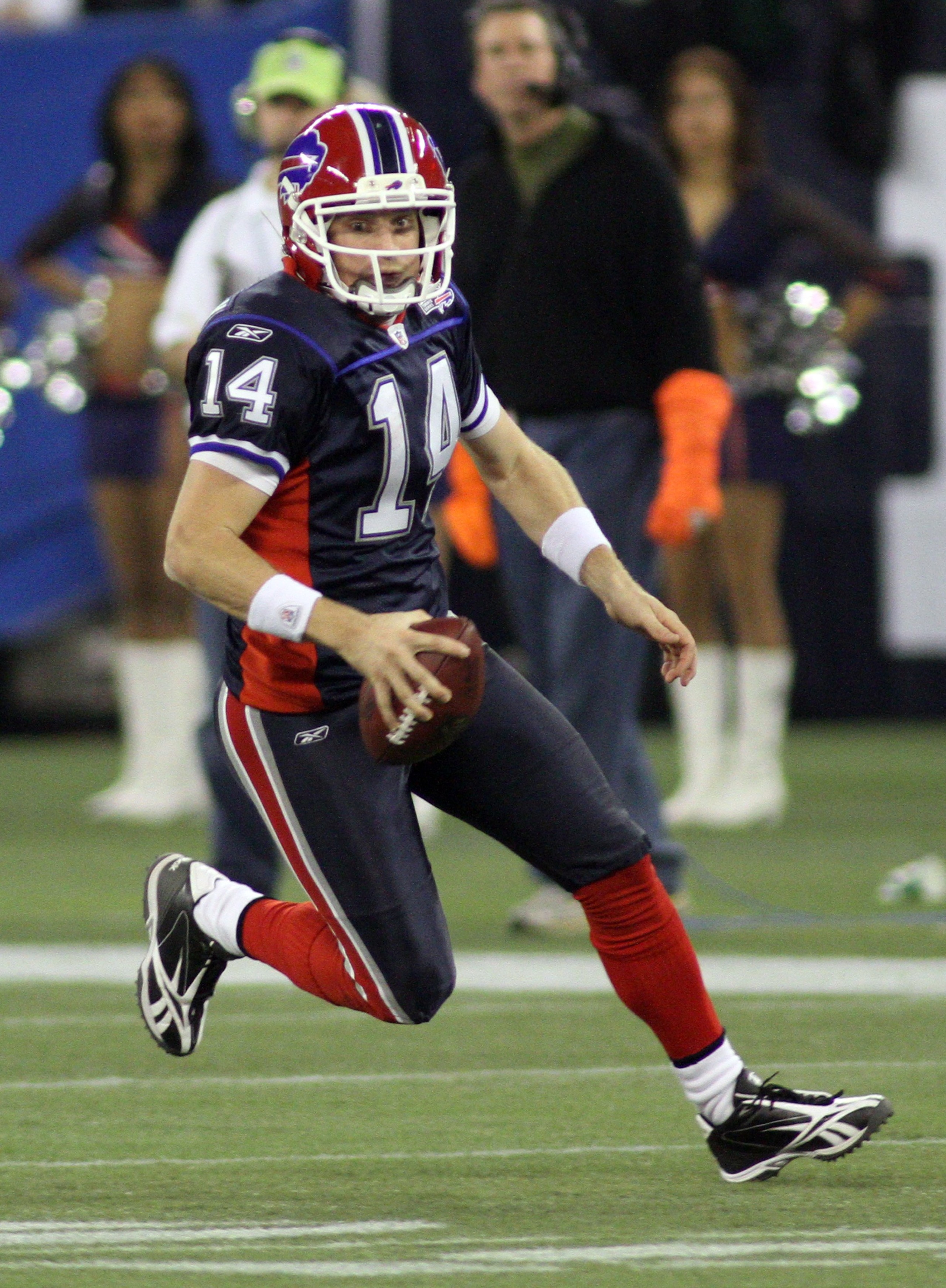 TORONTO - DECEMBER 3:  Quarterback Ryan Fitzpatrick #14 of the Buffalo Bills runs with the ball for yardage during their NFL game against the New York Jets on December 3, 2009  at Rogers Centre in Toronto, Ontario, Canada. The Jets defeated the Bills 19-1