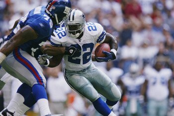 IRVING, TEXAS - OCTOBER 6:  Running back Emmitt Smith #22 of the Dallas Cowboys runs with the ball during the NFL game against the New York Giants on October 6, 2002 at Texas Stadium in Irving, TX.  The Giants defeated the Cowboys 21-17.  (Photo by Ronald