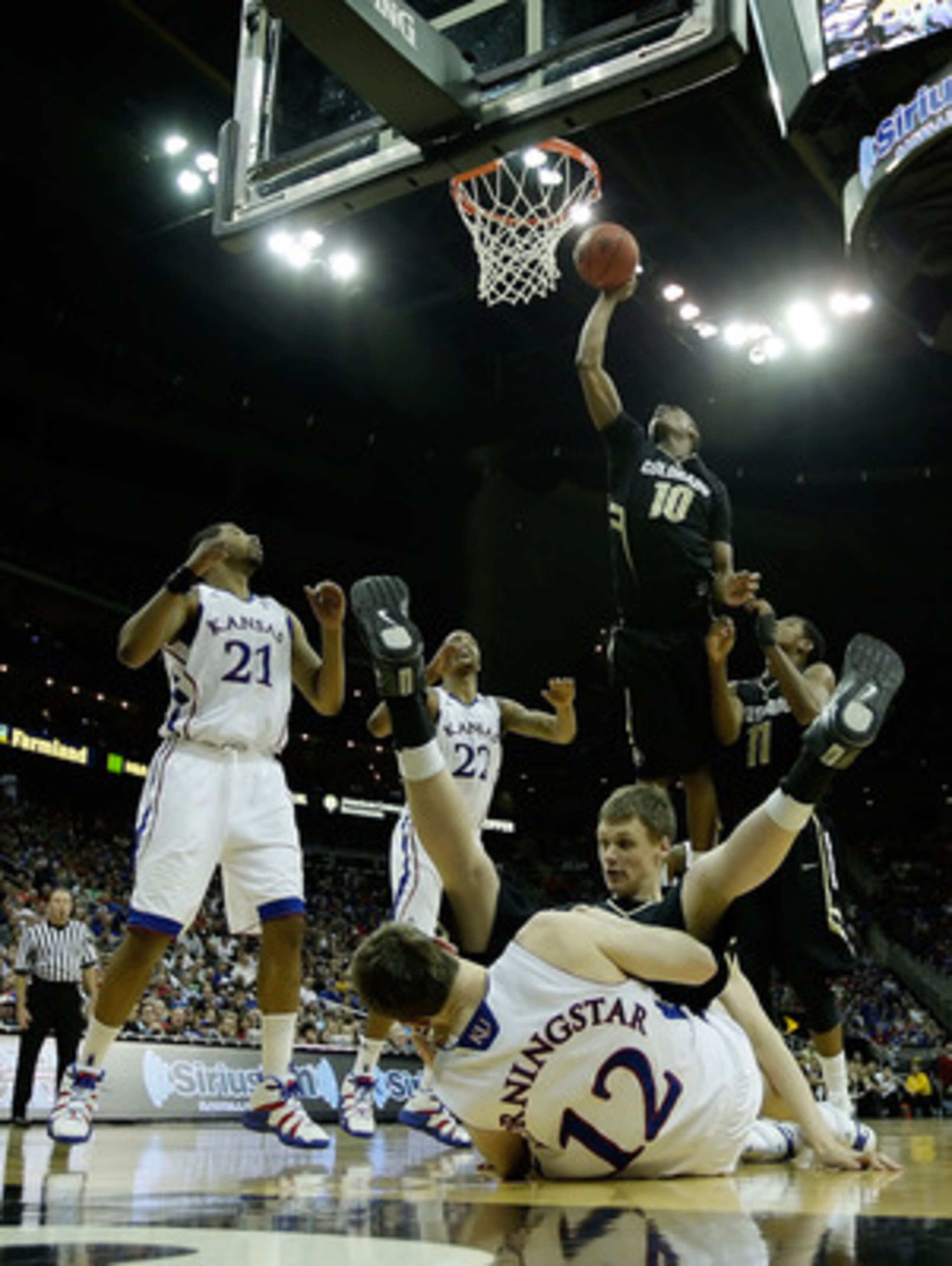 NEWARK, NJ - MARCH 25:  Brandon Knight #12 of the Kentucky Wildcats shoots the winning shot to defeat the Ohio State Buckeyes in the east regional semifinal of the 2011 NCAA Men's Basketball Tournament at the Prudential Center on March 25, 2011 in Newark,