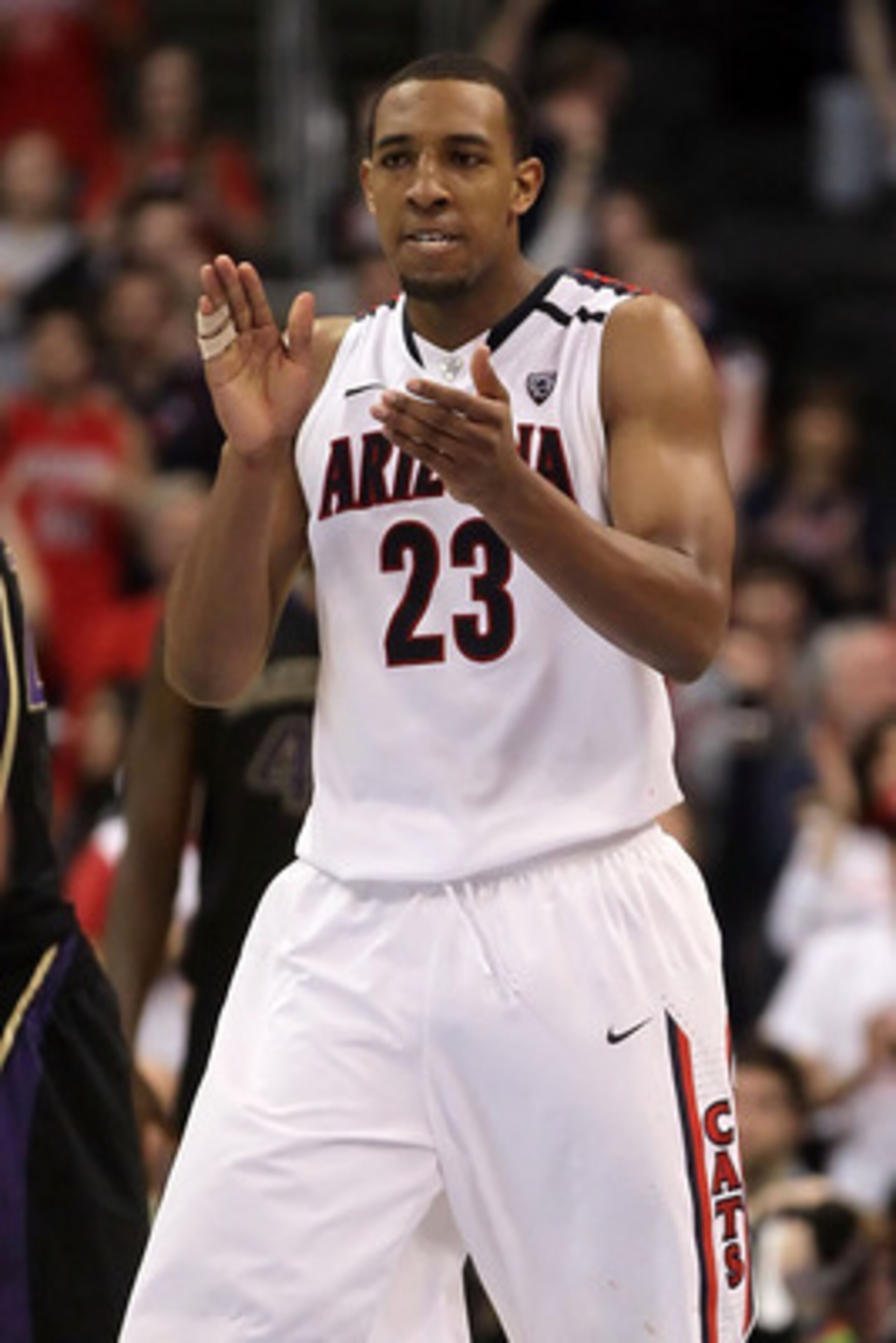 LOS ANGELES, CA - MARCH 12: Derrick Williams #23 of the Arizona Wildcats reacts in the second half while taking on the Washington Huskies in the championship game of the 2011 Pacific Life Pac-10 Men's Basketball Tournament at Staples Center on March 12, LOS ANGELES, CA - MARCH 12: Derrick Williams #23 of the Arizona Wildcats reacts in the second half while taking on the Washington Huskies in the championship game of the 2011 Pacific Life Pac-10 Men's Basketball Tournament at Staples Center on March 12,