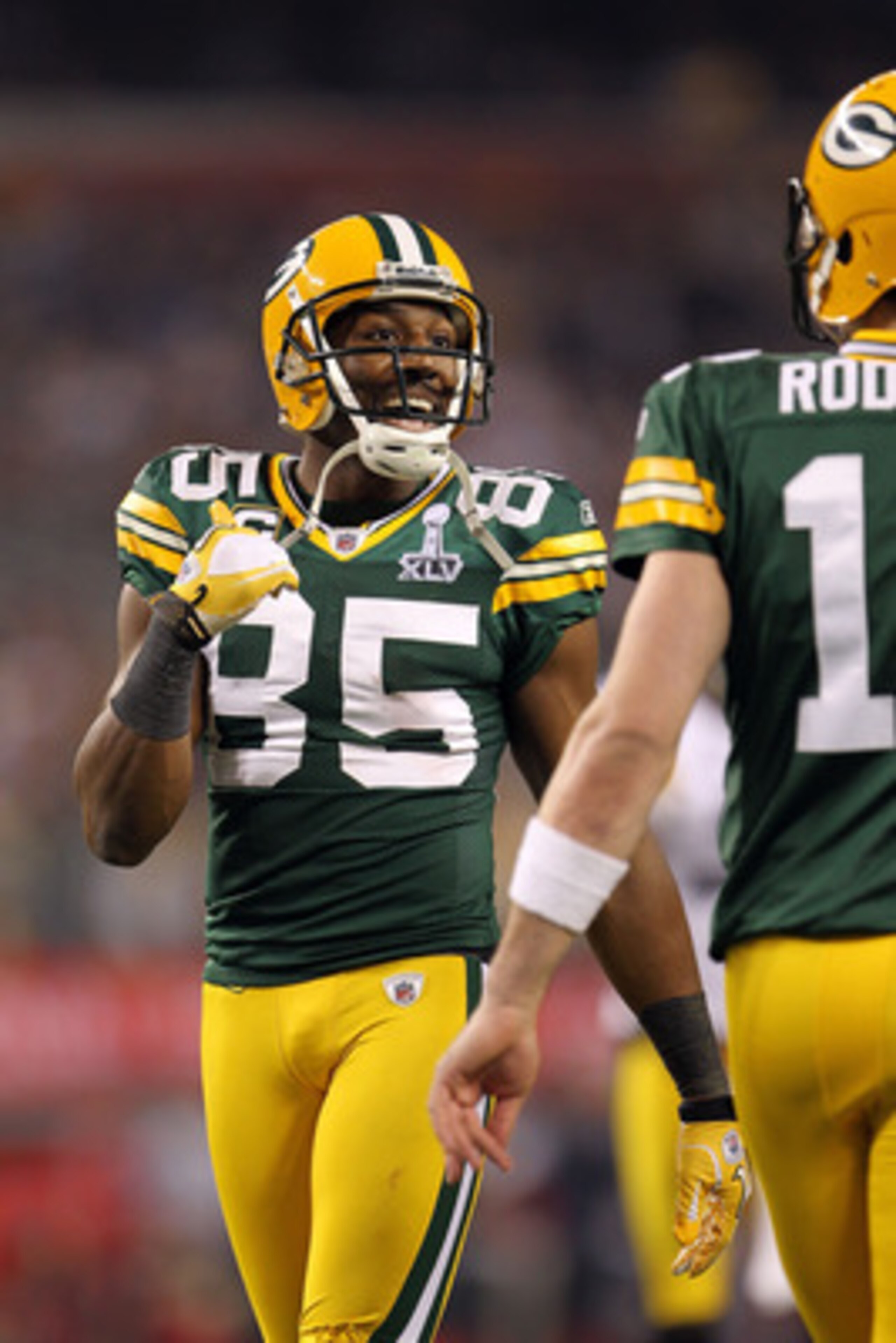 ARLINGTON, TX - FEBRUARY 06:  Greg Jennings #85 of the Green Bay Packers talks to quarterback Aaron Rodgers #13 against the Pittsburgh Steelers during Super Bowl XLV at Cowboys Stadium on February 6, 2011 in Arlington, Texas.  (Photo by Jamie Squire/Getty
