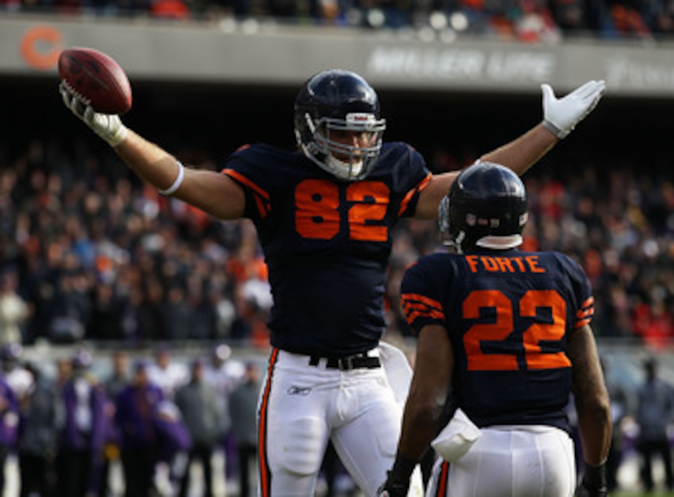 CHICAGO - NOVEMBER 14: Greg Olsen #82 of the Chicago Bears celebrates a touchdown catch with teammate Matt Forte #22 against the Minnesota Vikings at Soldier Field on November 14, 2010 in Chicago, Illinois. (Photo by Jonathan Daniel/Getty Images)