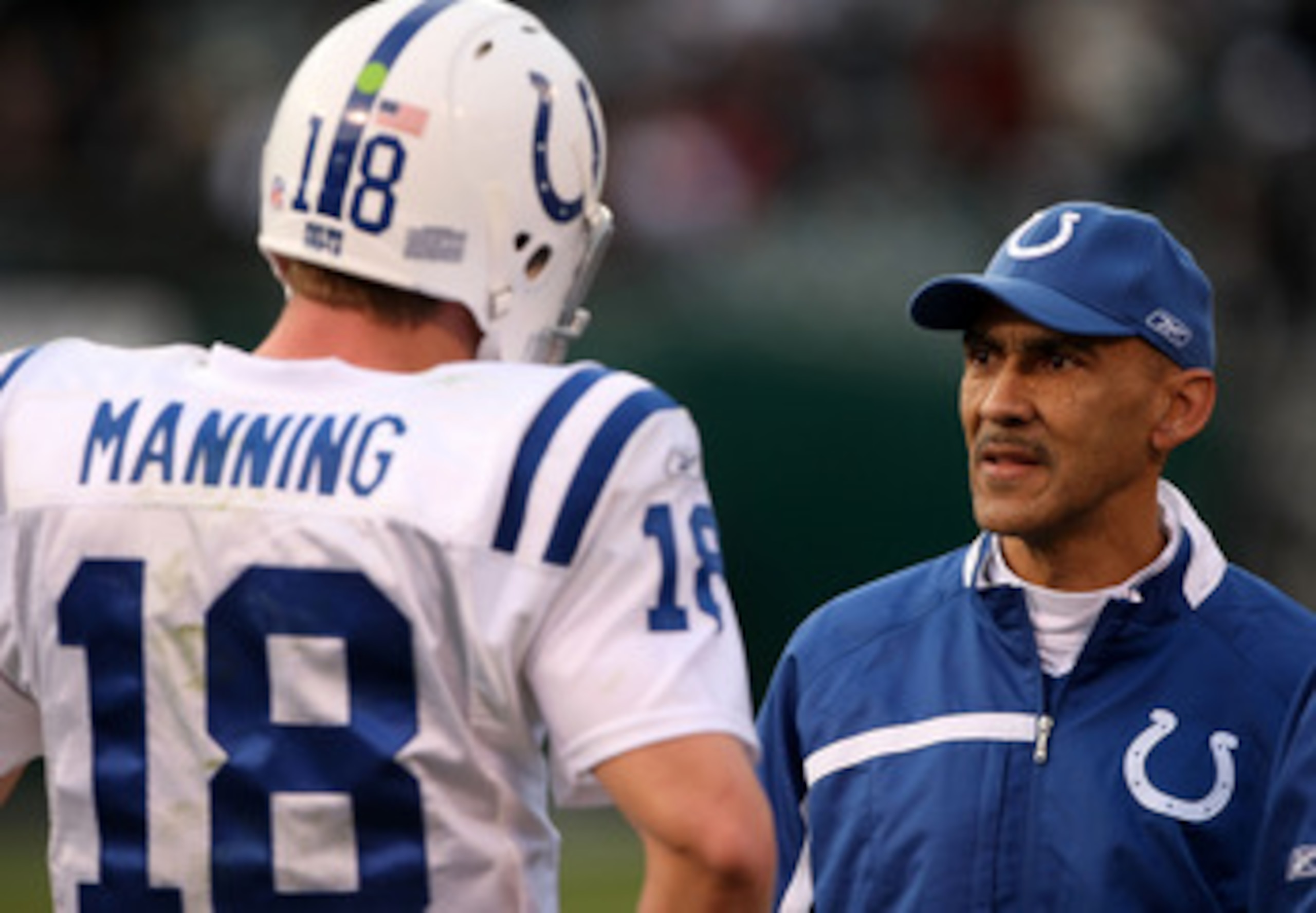 OAKLAND, CA - DECEMBER 16:  Head coach Tony Dungy and quarterback Peyton Manning #18 of the Indianapolis Colts confer during the game against the Oakland Raiders at McAfee Coliseum December 16, 2007 in Oakland, California. The Colts won 21-14.  (Photo by 