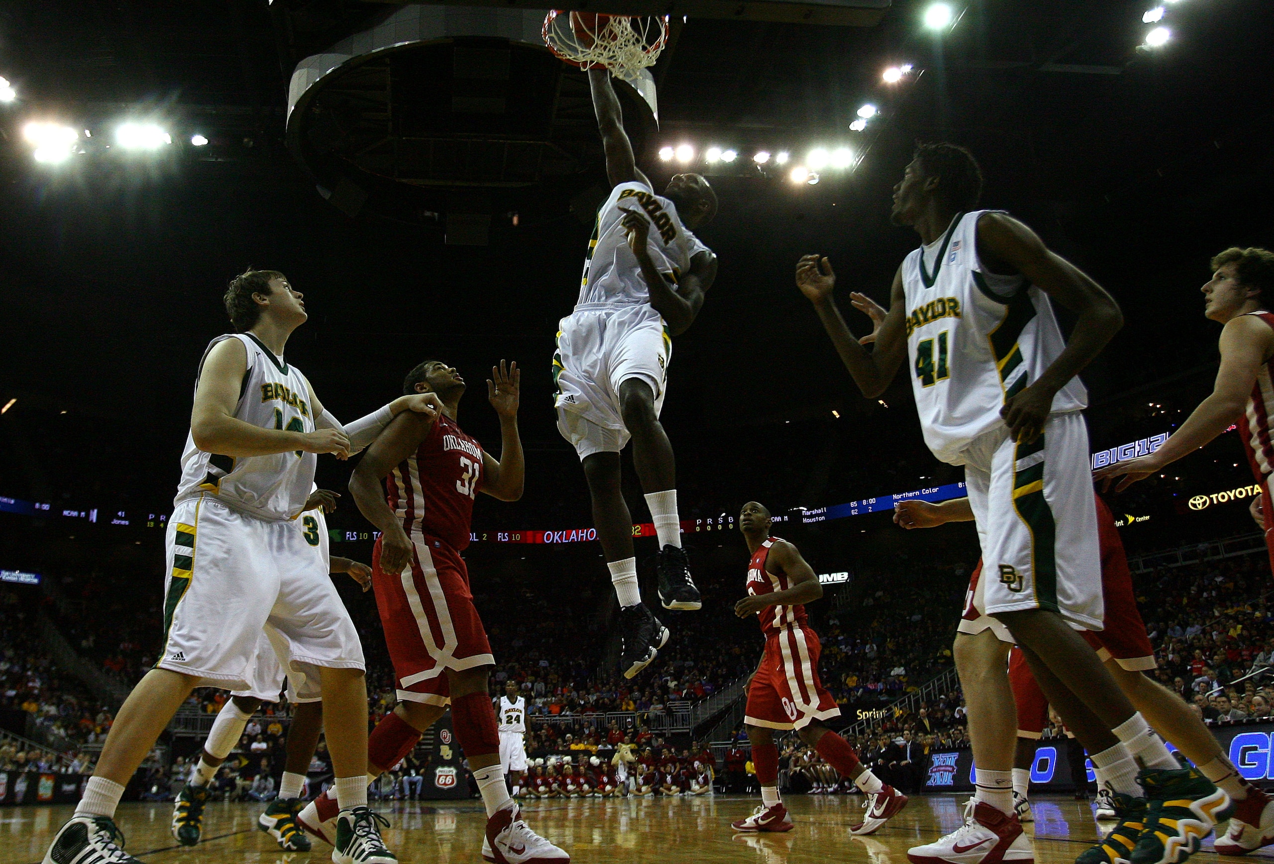 KANSAS CITY, MO - MARCH 09:  Quincy Acy #4 of the Baylor Bears dunks the ball against the Oklahoma Sooners during their game in the first round of the 2011 Phillips 66 Big 12 Men's Basketball Tournament at Sprint Center on March 9, 2011 in Kansas City, Mi