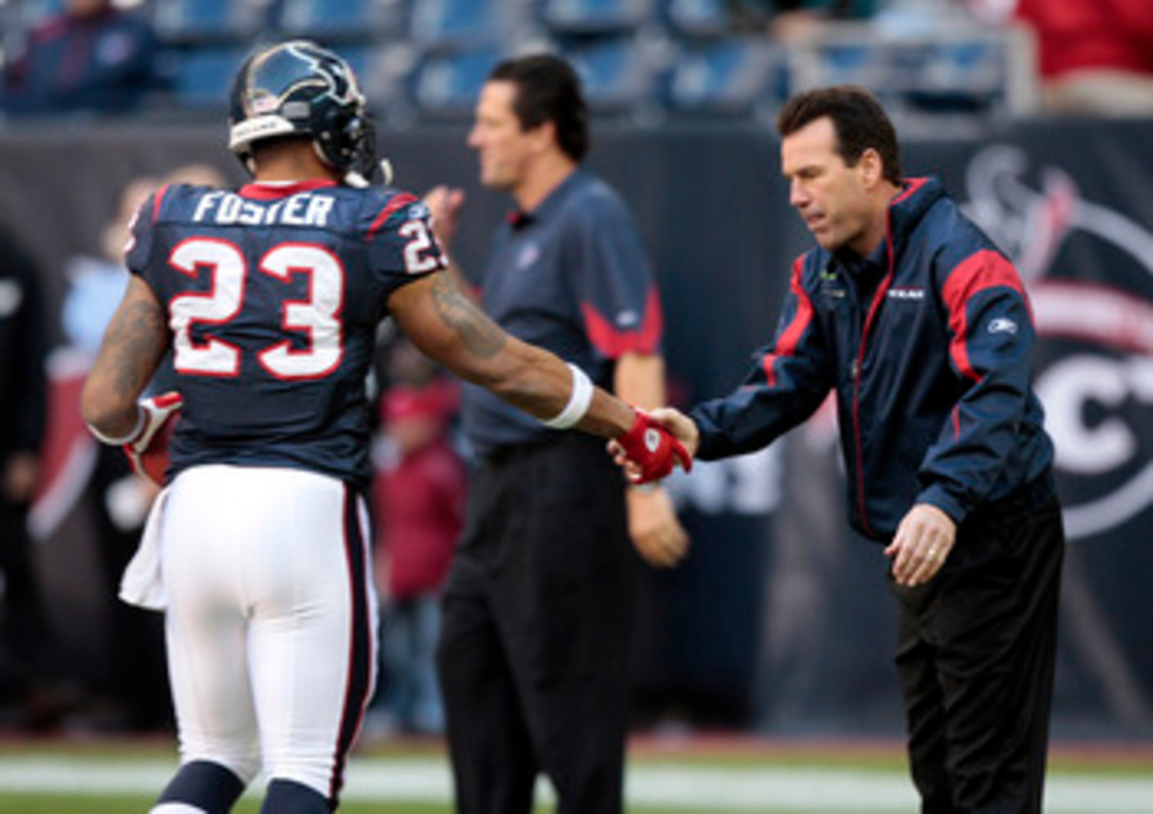 HOUSTON, TX - JANUARY 02:  Head coach Gary Kubiak of the Houston Texans greets running back Arian Foster #23 before playing the Jacksonville Jaguars at Reliant Stadium on January 2, 2011 in Houston, Texas.  (Photo by Bob Levey/Getty Images)