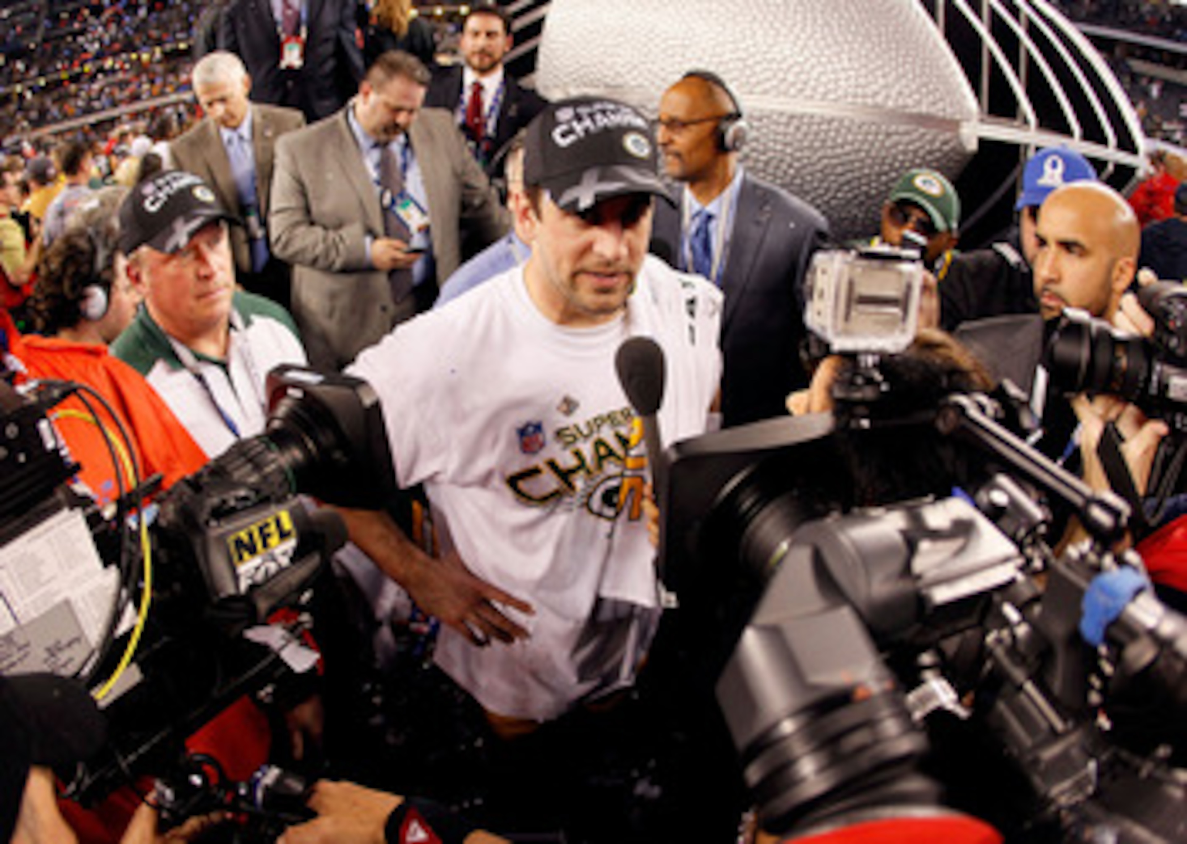 ARLINGTON, TX - FEBRUARY 06:  Super Bowl MVP Aaron Rodgers #12 of the Green Bay Packers is interviewed by the media after the Packers won Super Bowl XLV 31-25 against the Pittsburgh Steelers at Cowboys Stadium on February 6, 2011 in Arlington, Texas.  (Ph