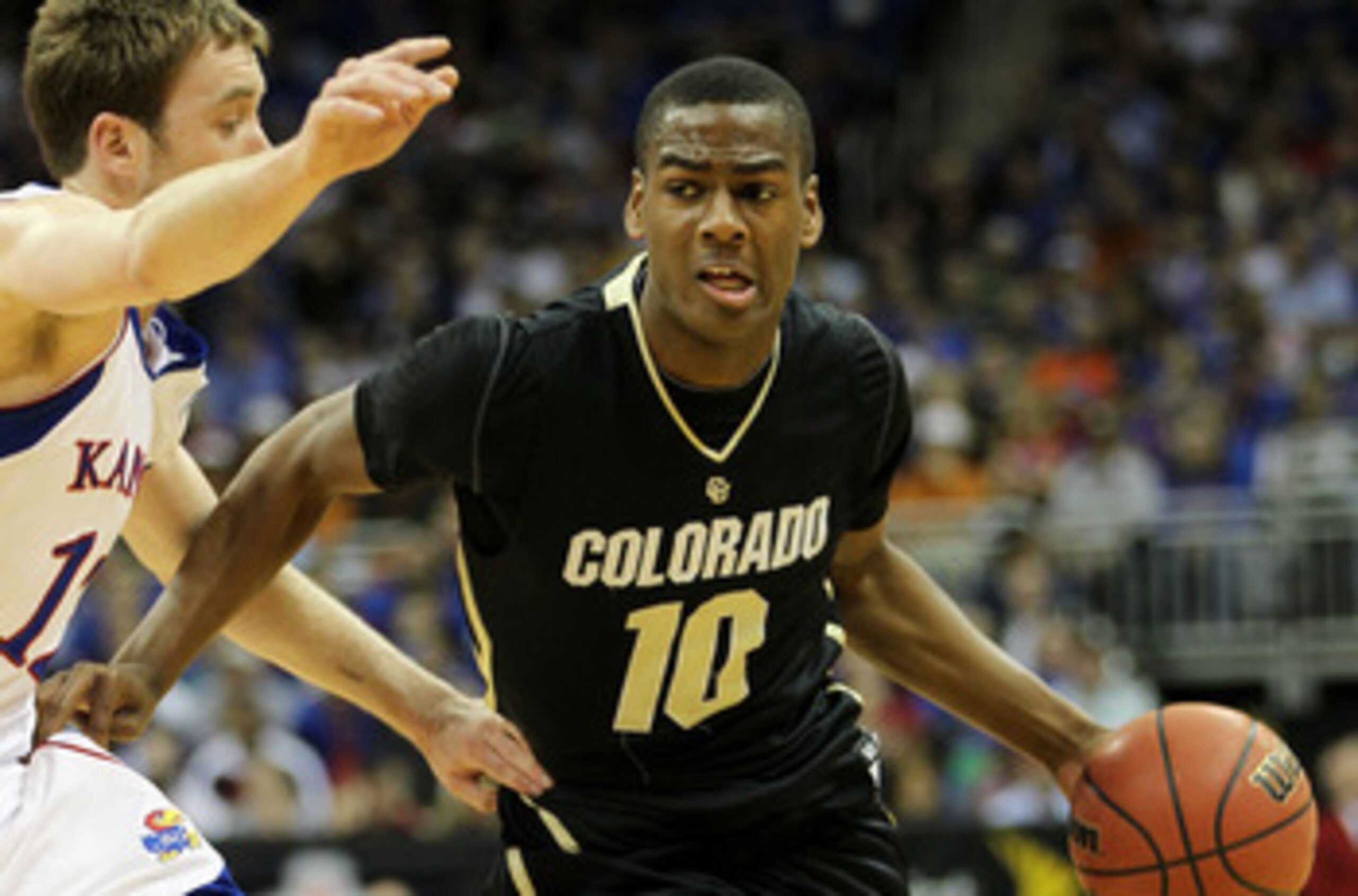 KANSAS CITY, MO - MARCH 11: Alec Burks #10 of the Colorado Buffaloes drives with the ball against the Kansas Jayhawks during their semifinal game in the 2011 Phillips 66 Big 12 Men's Basketball Tournament at Sprint Center on March 11, 2011 in Kansas City KANSAS CITY, MO - MARCH 11: Alec Burks #10 of the Colorado Buffaloes drives with the ball against the Kansas Jayhawks during their semifinal game in the 2011 Phillips 66 Big 12 Men's Basketball Tournament at Sprint Center on March 11, 2011 in Kansas City