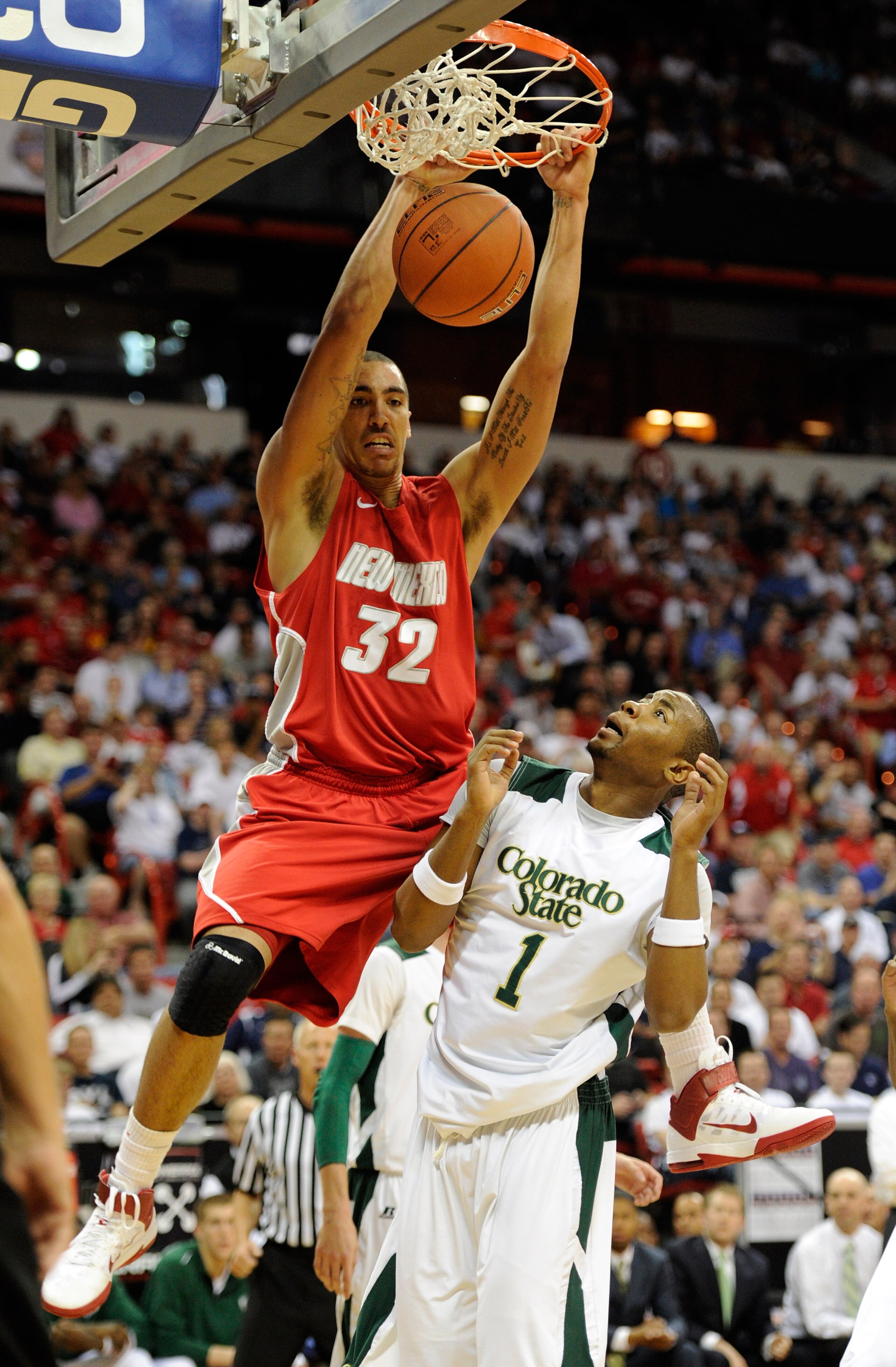 LAS VEGAS, NV - MARCH 10:  Drew Gordon #32 of the New Mexico Lobos dunks over Travis Franklin #1 of the Colorado State Rams during a quarterfinal game of the Conoco Mountain West Conference Basketball tournament at the Thomas & Mack Center March 10, 2011