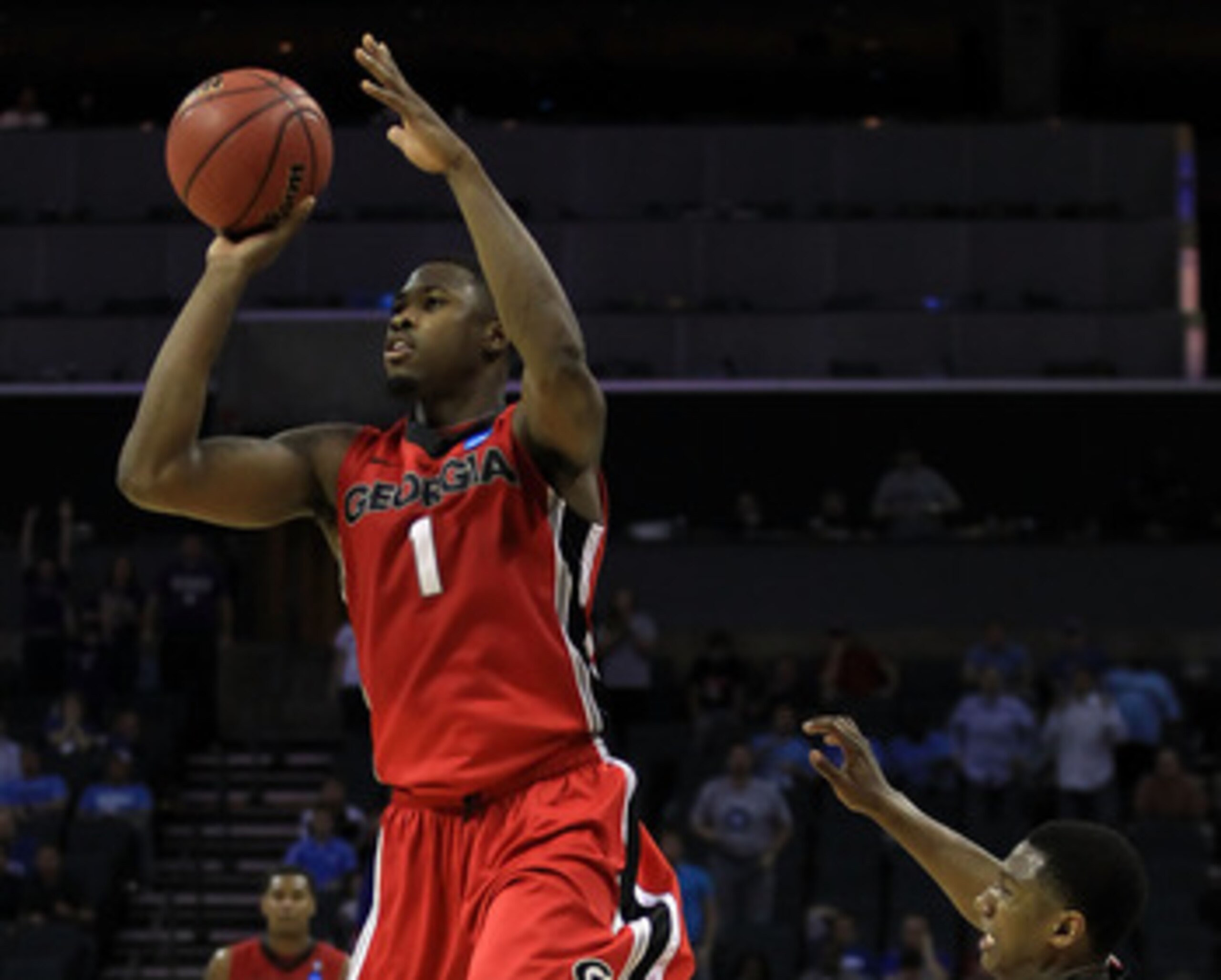 CHARLOTTE, NC - MARCH 18: Travis Leslie #1 of the Georgia Bulldogs misses a last second three-pointer that would have tied the game against the Washington Huskies during the second round of the 2011 NCAA men's basketball tournament at Time Warner Cable A CHARLOTTE, NC - MARCH 18: Travis Leslie #1 of the Georgia Bulldogs misses a last second three-pointer that would have tied the game against the Washington Huskies during the second round of the 2011 NCAA men's basketball tournament at Time Warner Cable A