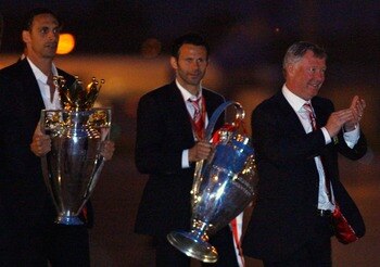 MANCHESTER - MAY 22:  Rio Ferdinand, Ryan Giggs and Alex Ferguson arrive back from Moscow after their win over Chelsea in the Champions League final on May 22, 2008 in Manchester, England.  (Photo by Jeff J Mitchell/Getty Images)