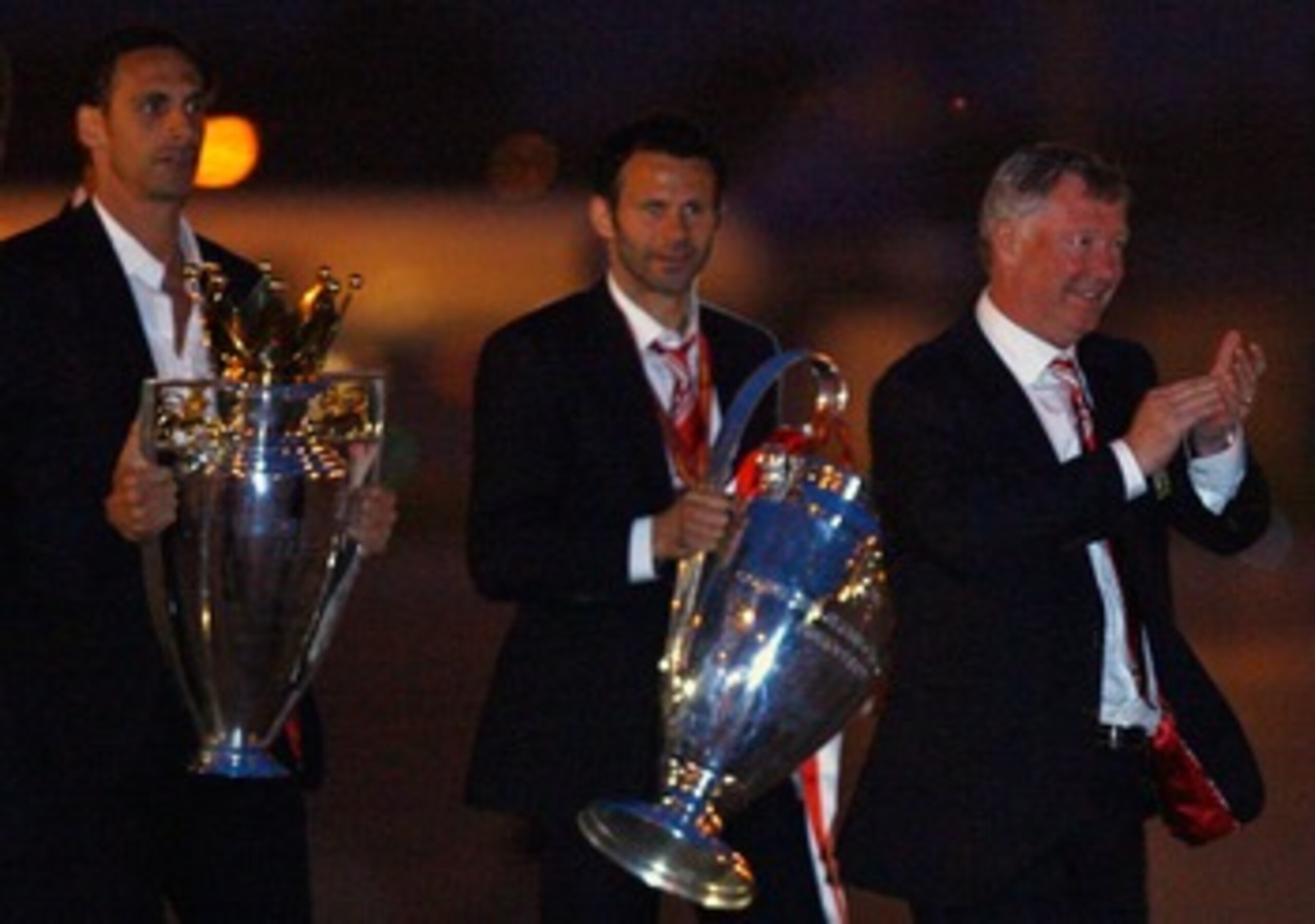 MANCHESTER - MAY 22:  Rio Ferdinand, Ryan Giggs and Alex Ferguson arrive back from Moscow after their win over Chelsea in the Champions League final on May 22, 2008 in Manchester, England.  (Photo by Jeff J Mitchell/Getty Images)