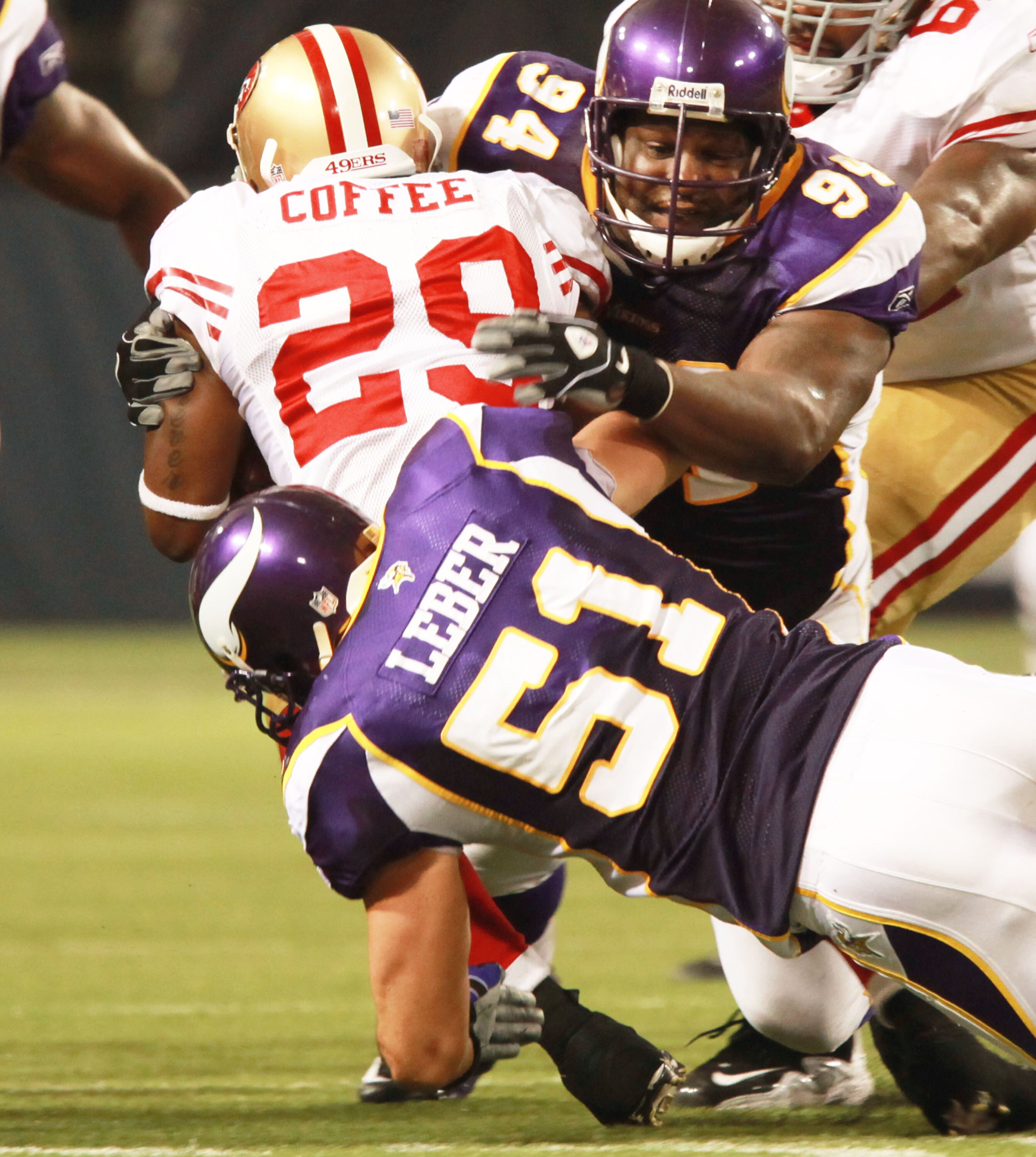 MINNEAPOLIS, MN - SEPTEMBER 27: Glen Coffee #29 of the San Francisco 49ers is stopped by Ben Leber #51 of the Minnesota Vikings along with teammate Pat Williams #94 at Hubert H. Humphrey Metrodome on September 27, 2009 in Minneapolis, Minnesota. The Vikin