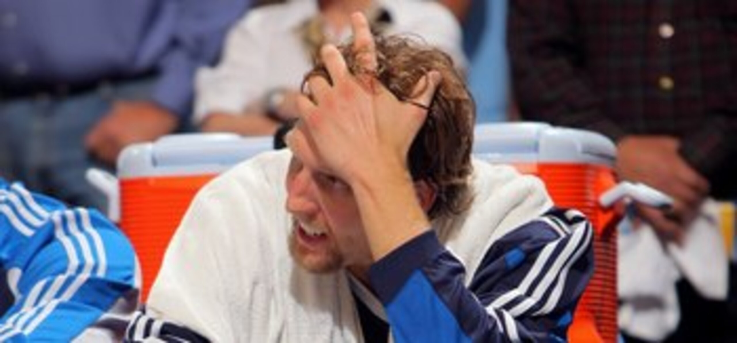 DENVER - MAY 05:  Dirk Nowitzki #41 of the Dallas Mavericks sits on the bench late in the fourth quarter against the Denver Nuggets in Game Two of the Western Conference Semifinals during the 2009 NBA Playoffs at Pepsi Center on May 5, 2009 in Denver, Col