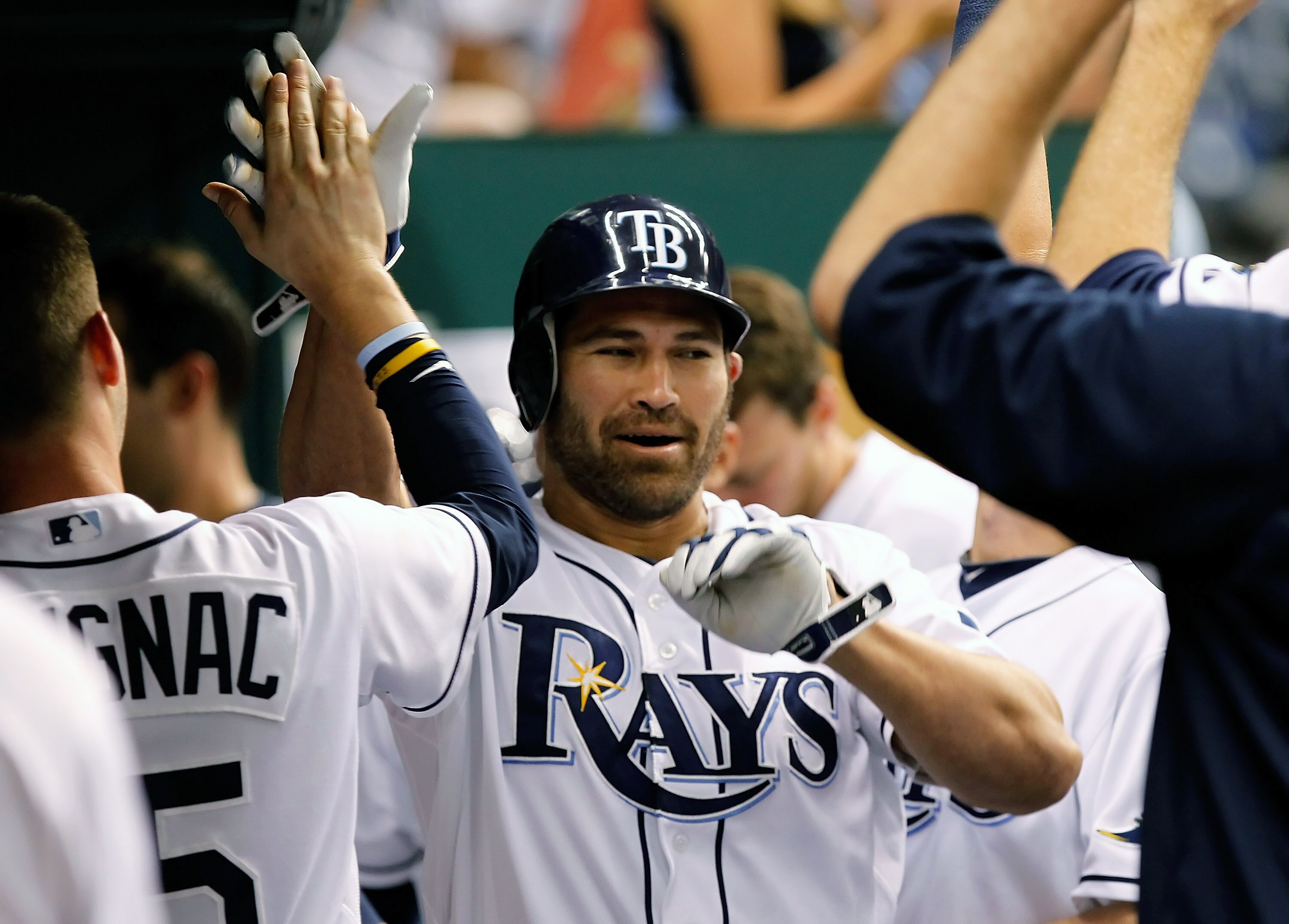 ST. PETERSBURG, FL - MAY 16:  Designated hitter Johnny Damon #22 of the Tampa Bay Rays is congratulated after his home run against the New York Yankees during the game at Tropicana Field on May 16, 2011 in St. Petersburg, Florida.  (Photo by J. Meric/Gett